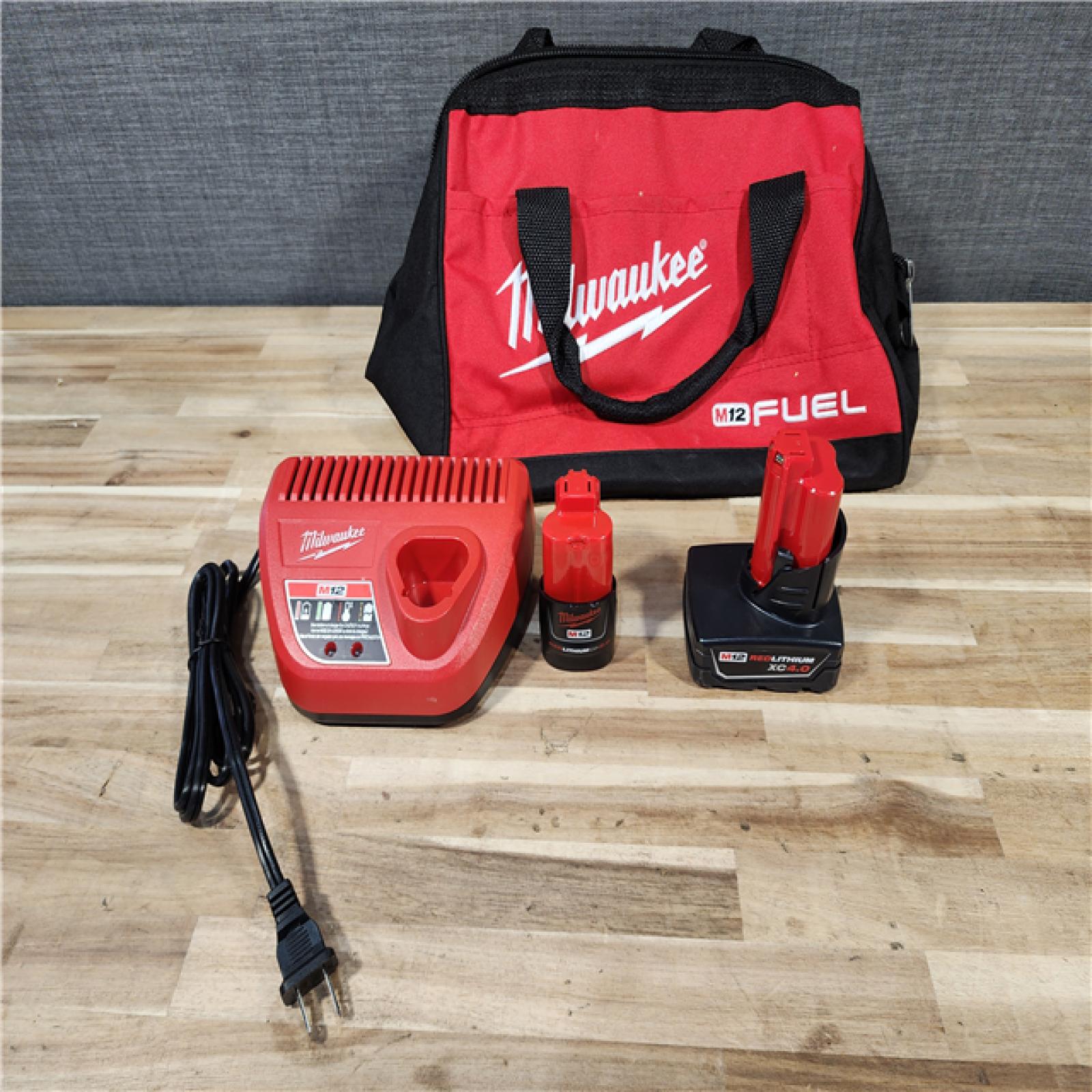 HOUSTON LOCATION - AS-IS Milwaukee FUEL 12-Volt Lithium-Ion Brushless Cordless Hammer Drill and Impact Driver Combo Kit