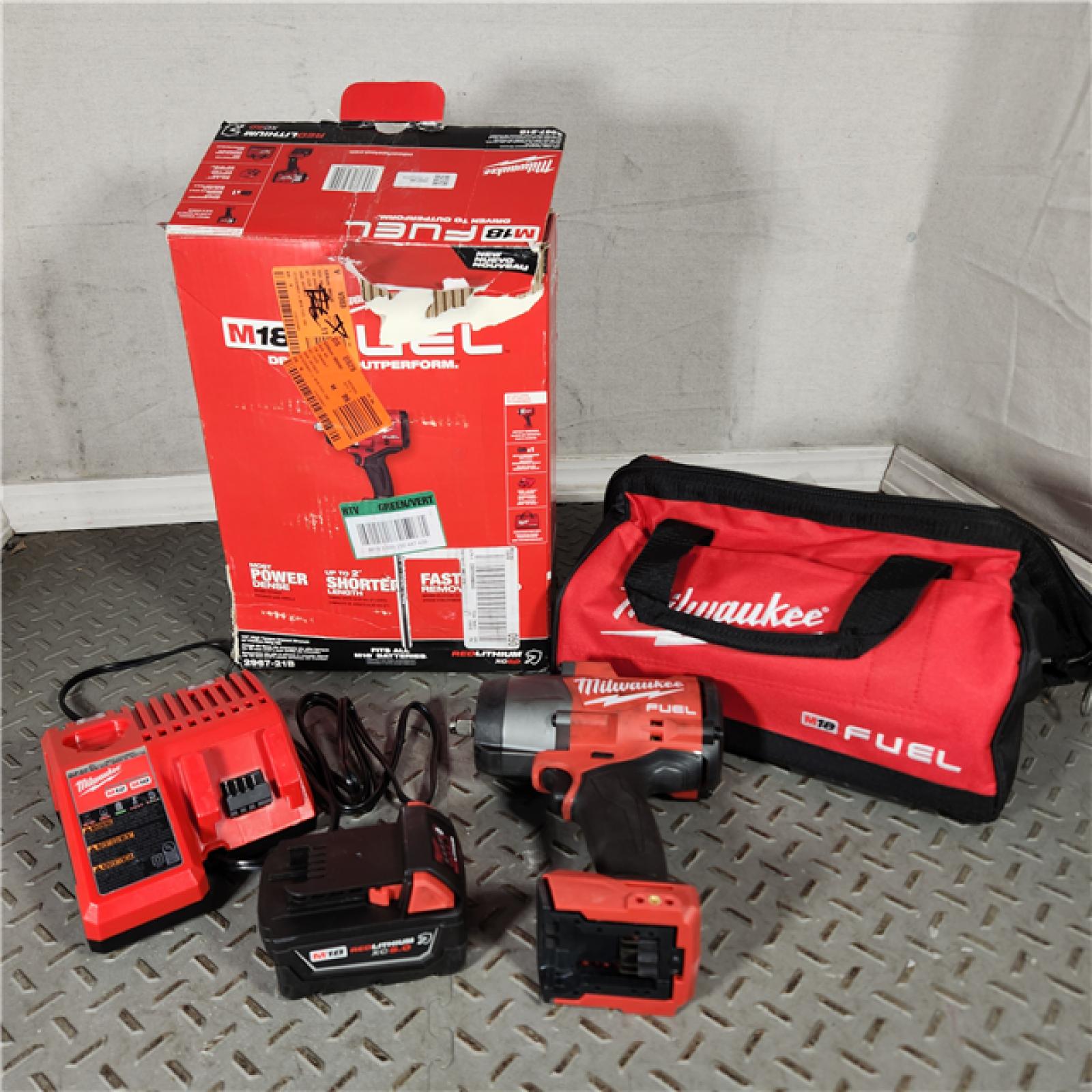 Houston location- AS-IS Milwaukee M18 FUEL 1/2 High Torque Impact Wrench with Friction Ring Kit Appears in good condition