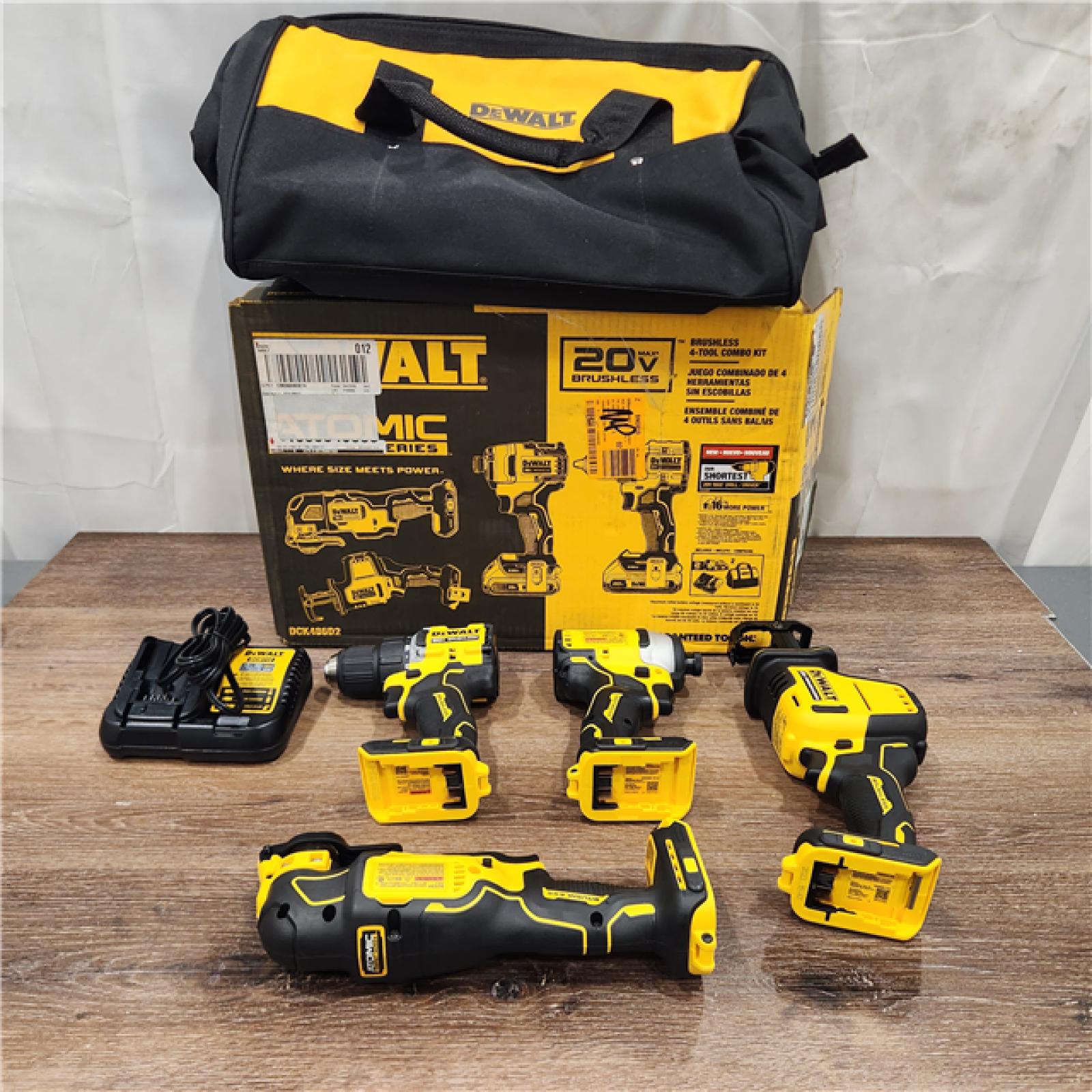AS-IS DEWALT ATOMIC 20-Volt Lithium-Ion Cordless Brushless Combo Kit (4-Tool)  Charger and Bag battery included