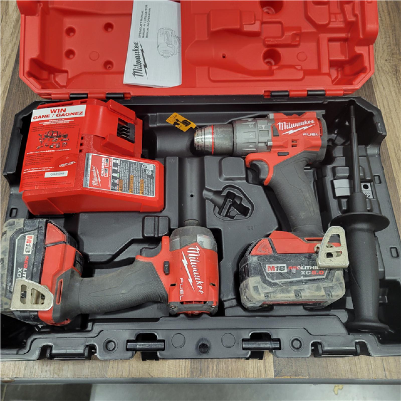 AS-IS Milwaukee M18 FUEL 18V Lithium-Ion Brushless Cordless Hammer Drill and Impact Driver Combo Kit (2-Tool) with 2 Batteries