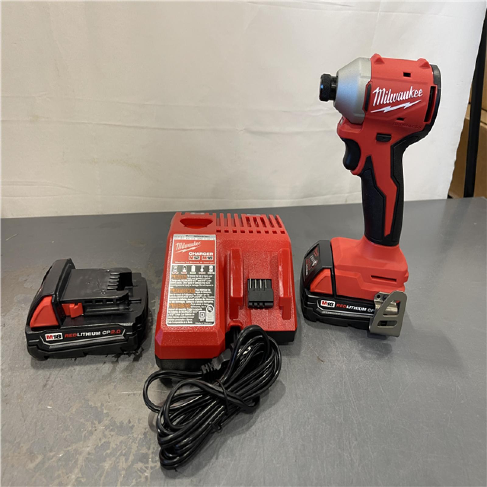 AS-IS - Milwaukee M18 18V Lithium-Ion Brushless Cordless 1/4 in. Impact Driver Kit