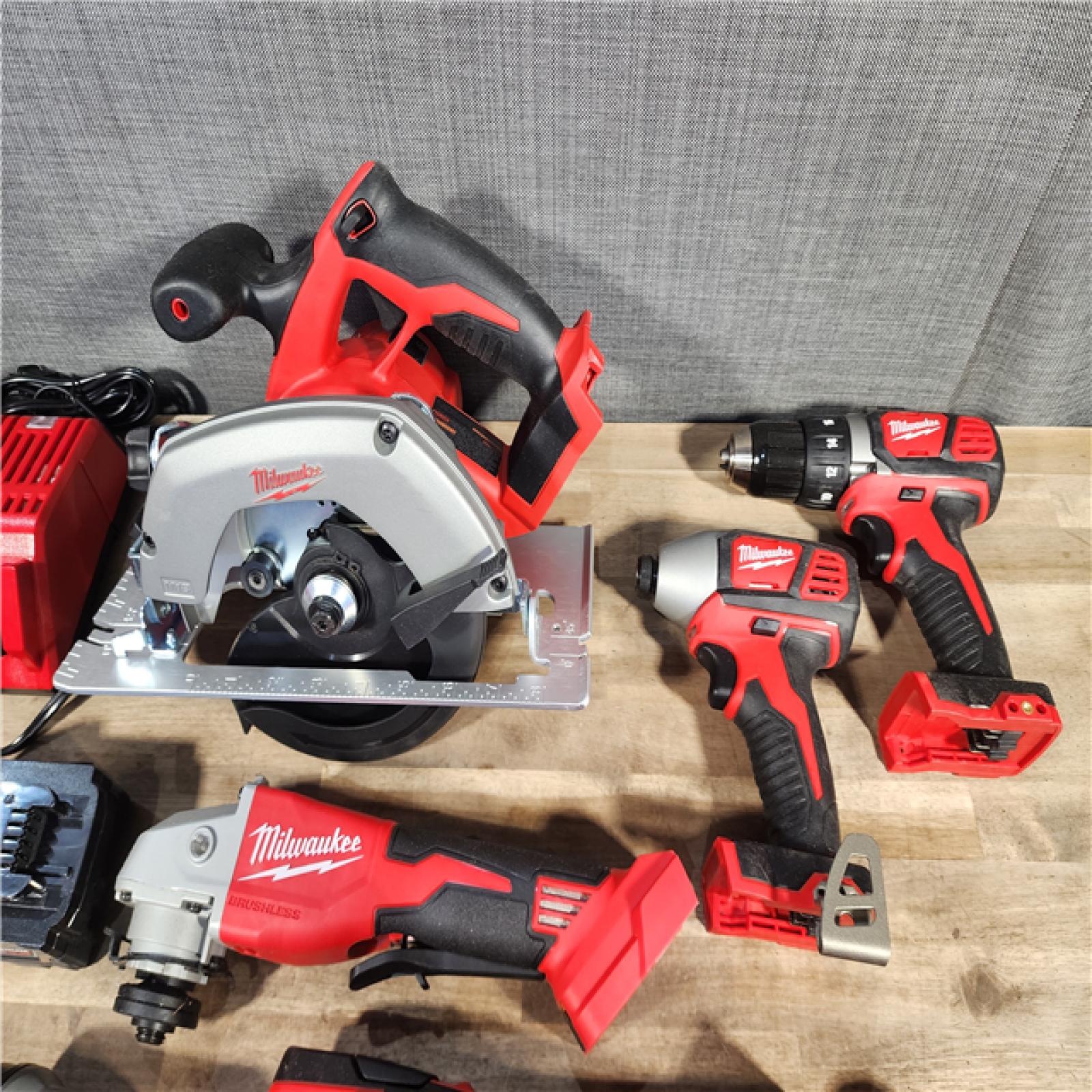 HOUSTON LOCATION - AS-IS Milwaukee M18 18-Volt Lithium-Ion Cordless Combo Kit 7-Tool with 2-Batteries, Charger and Tool Bag