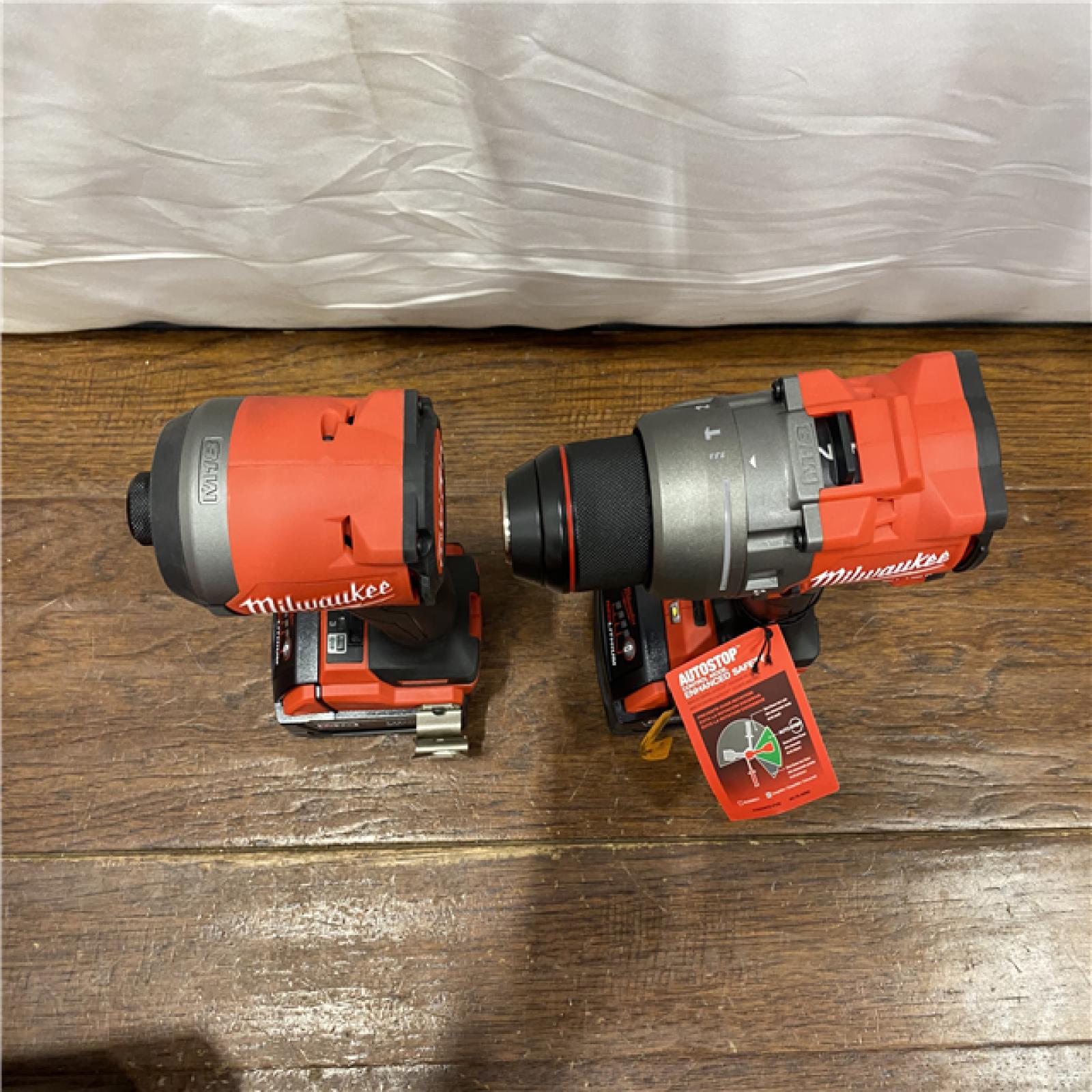 AS-IS MILWAUKEE M18 FUEL 18V Lithium-Ion Brushless Cordless Hammer Drill and Impact Driver Combo Kit (2-Tool) with 2 Batteries