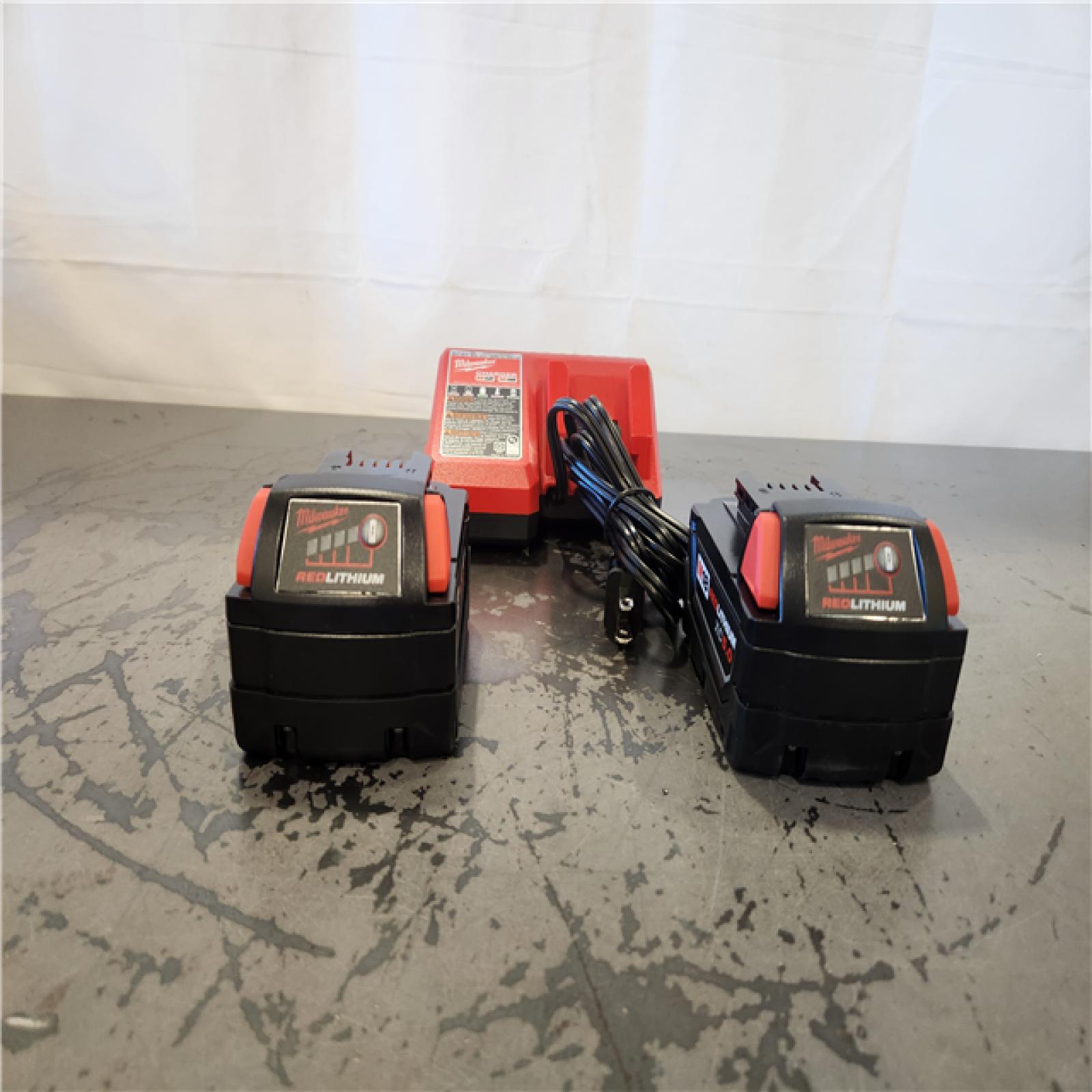AS-IS-- Milwaukee 18-Volt Lithium-Ion XC Starter Kit with Two 5.0Ah Batteries and Charger