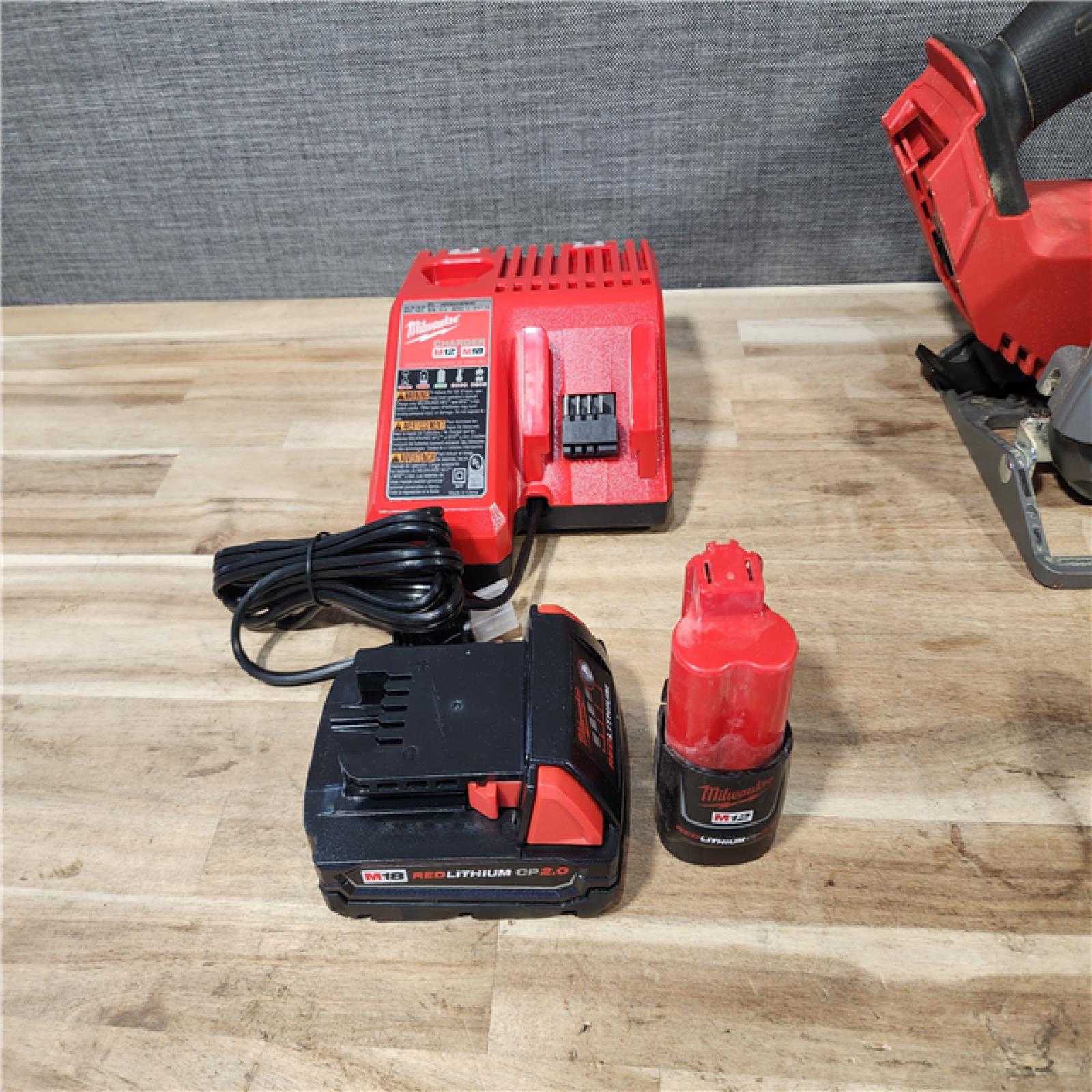 HOUSTON LOCATION - AS-IS MILWAUKEE 3 TOOL COMBO KIT W/ (2) BATTERY & CHARGER