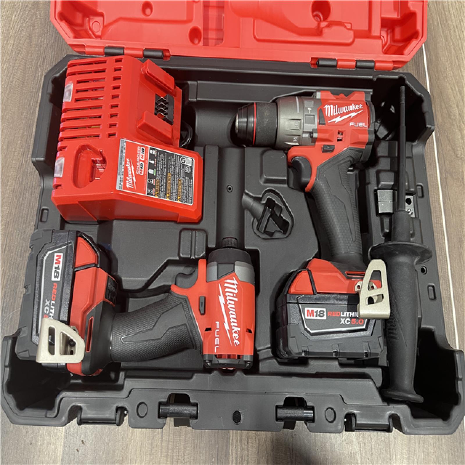 AS-IS Milwaukee FUEL 18V Lithium-Ion Brushless Cordless Hammer Drill and Impact Driver Combo Kit