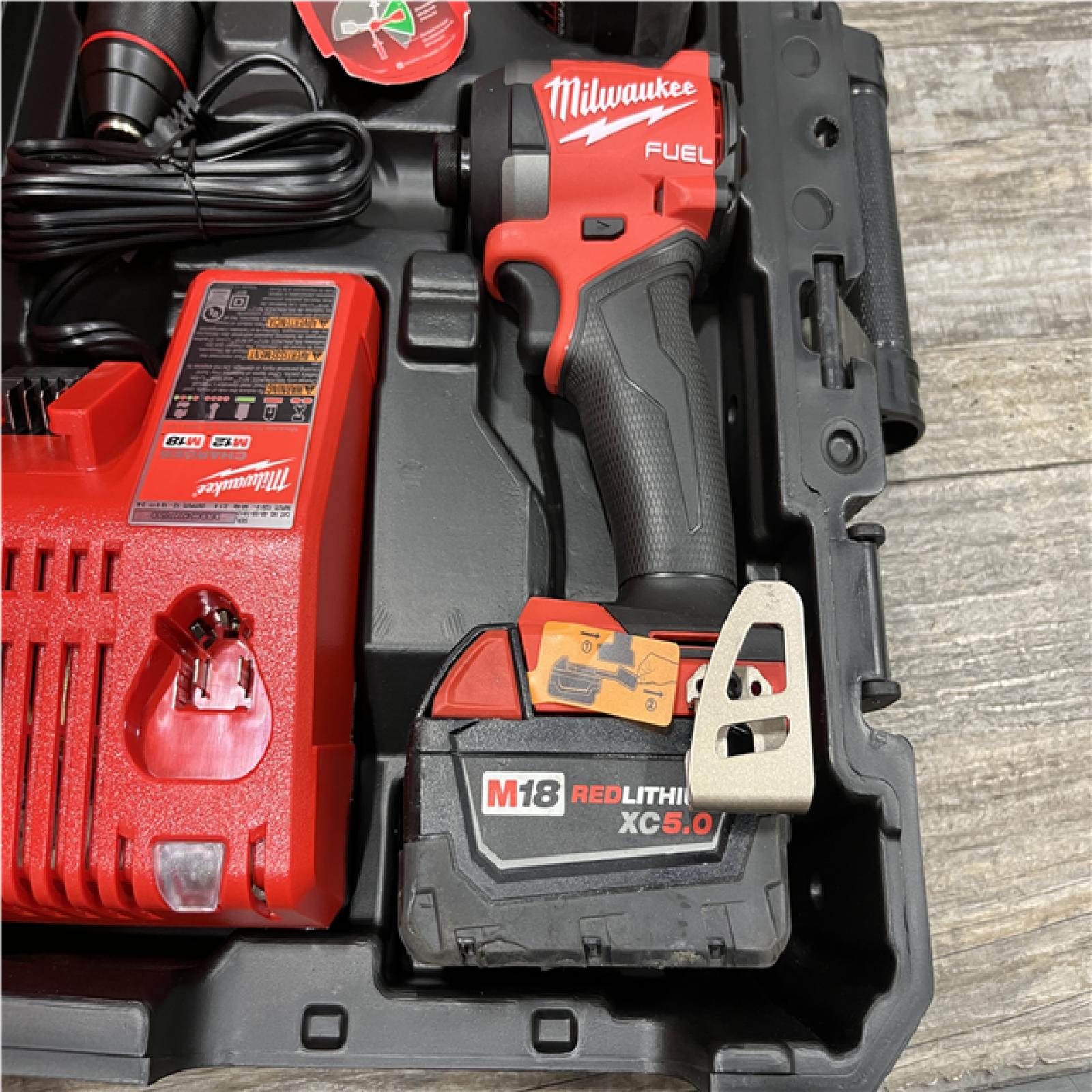 AS-IS Milwaukee FUEL 18V Lithium-Ion Brushless Cordless Hammer Drill and Impact Driver Combo Kit