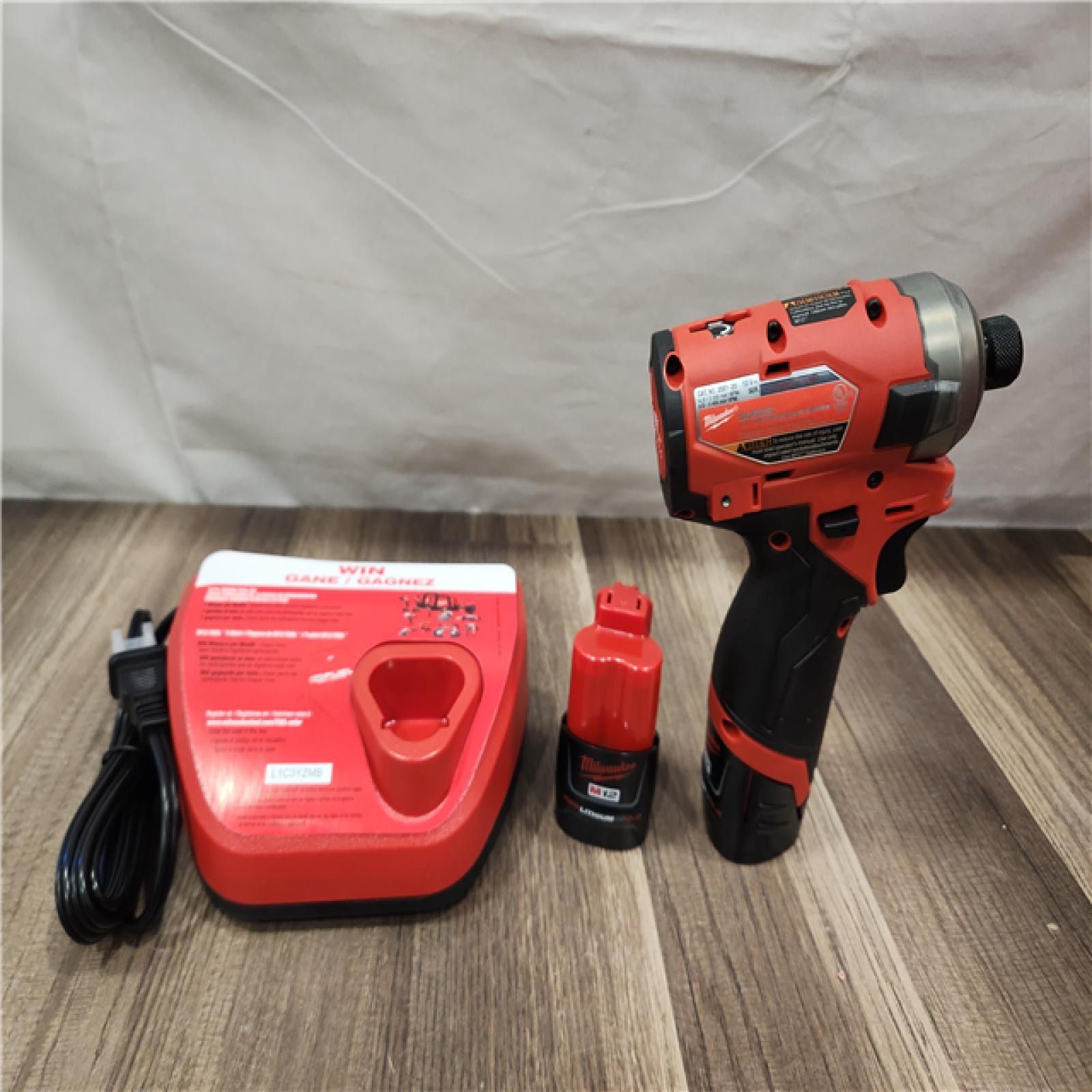 AS-IS- Milwaukee M12 FUEL SURGE 12V Lithium-Ion Brushless Cordless 1/4 in. Hex Impact Driver Compact Kit W/Two 2.0Ah Batteries  Bag