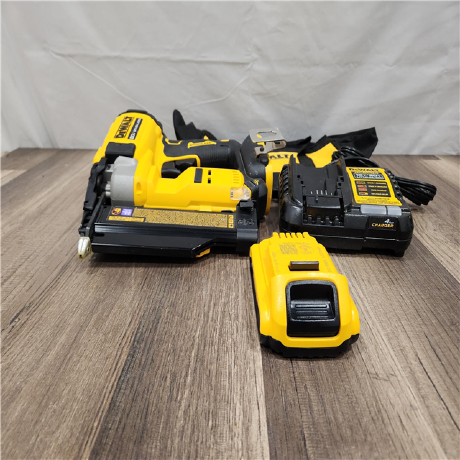 AS-IS DEWALT ATOMIC 20V MAX Lithium Ion Cordless 23 Gauge Pin Nailer Kit with 2.0Ah Battery and Charger