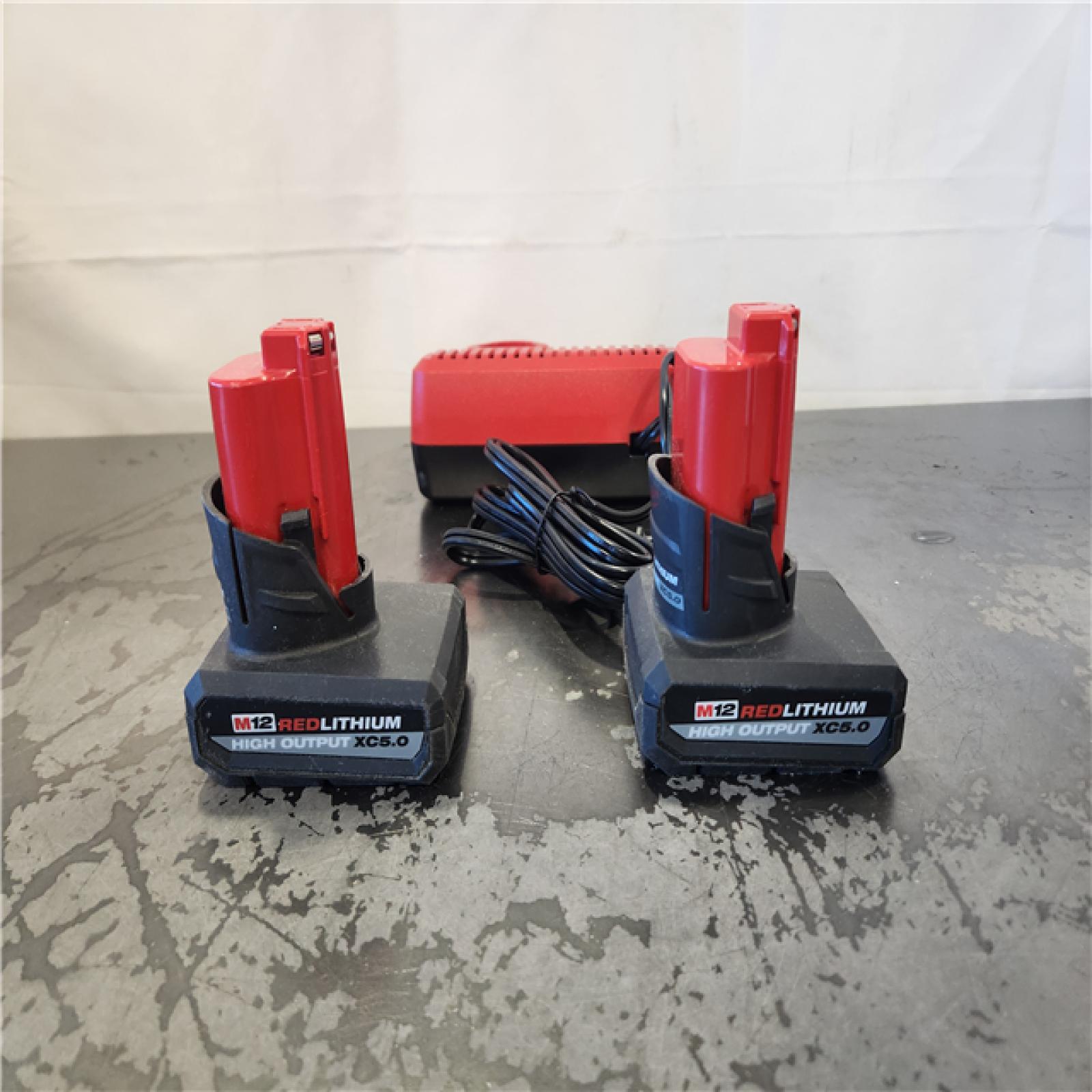 AS-IS- Milwaukee 12V Lithium-Ion XC High Output 5.0 Ah Battery Pack (2-Pack) Starter Kit with Charger