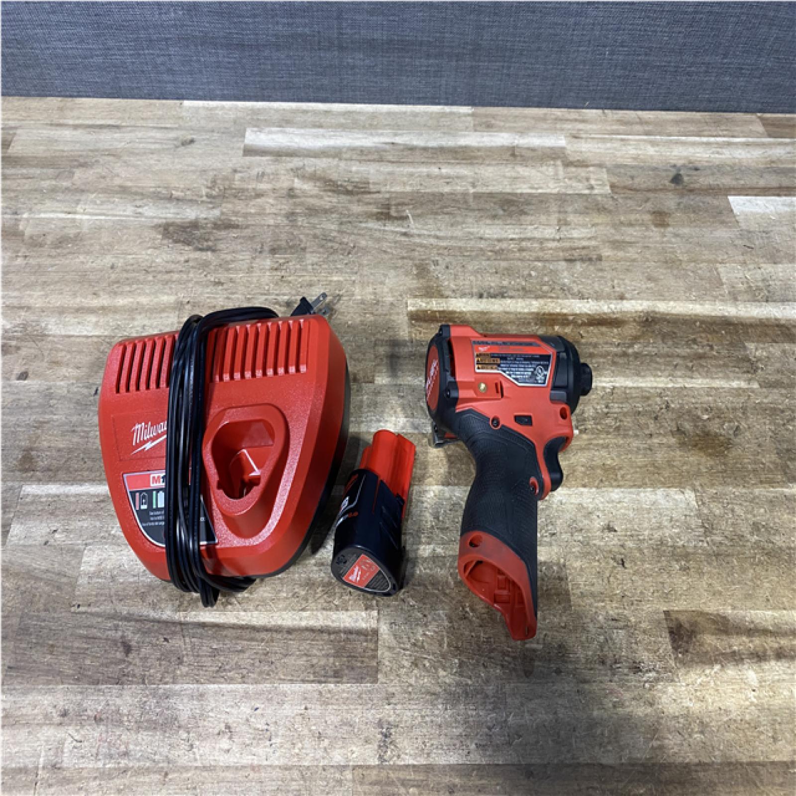 Houston Location AS-IS Milwaukee FUEL Impact Driver and Battery with Charger