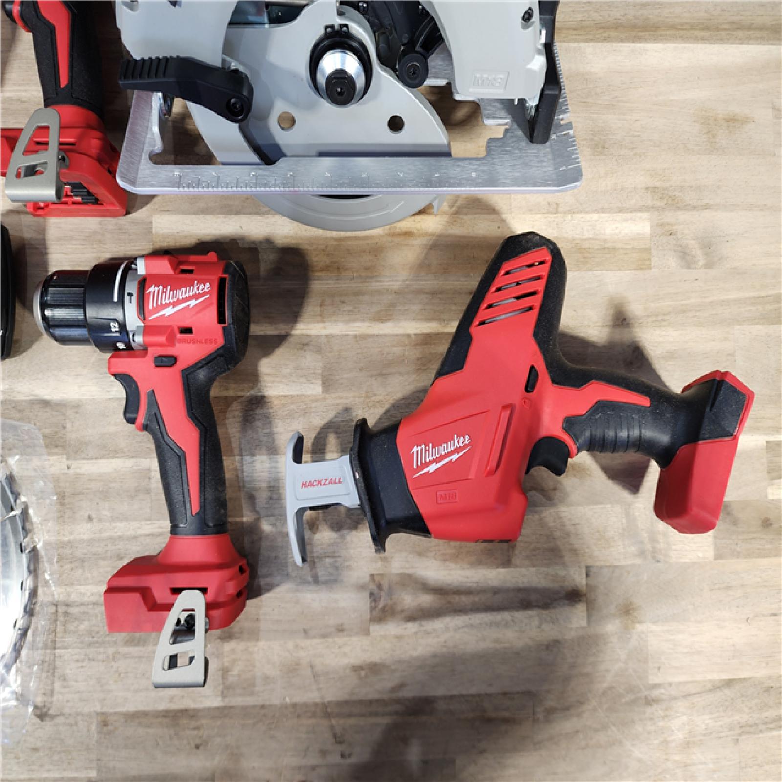 HOUSTON LOCATION - AS-IS Milwaukee M18 18-Volt Lithium-Ion Brushless Cordless Combo Kit (4-Tool) with 2-Batteries, 1-Charger and Tool Bag