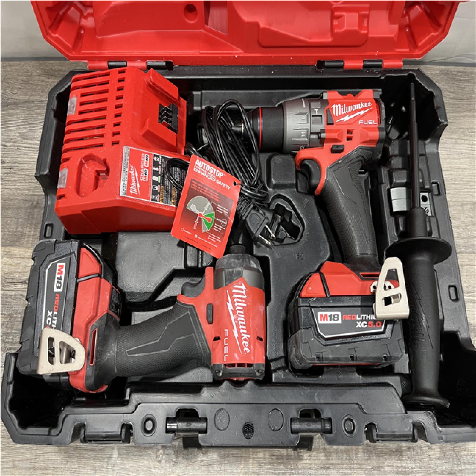 AS-IS Milwaukee FUEL 18V Lithium-Ion Brushless Cordless Hammer Drill and Impact Driver Combo Kit