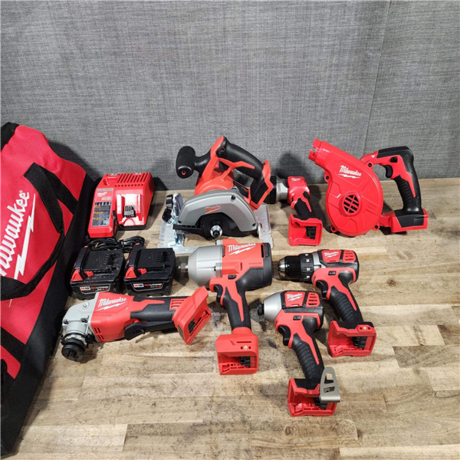 HOUSTON LOCATION - AS-IS Milwaukee M18 18-Volt Lithium-Ion Cordless Combo Kit (7-Tool) with (2) Batteries  Charger  and Tool Bag