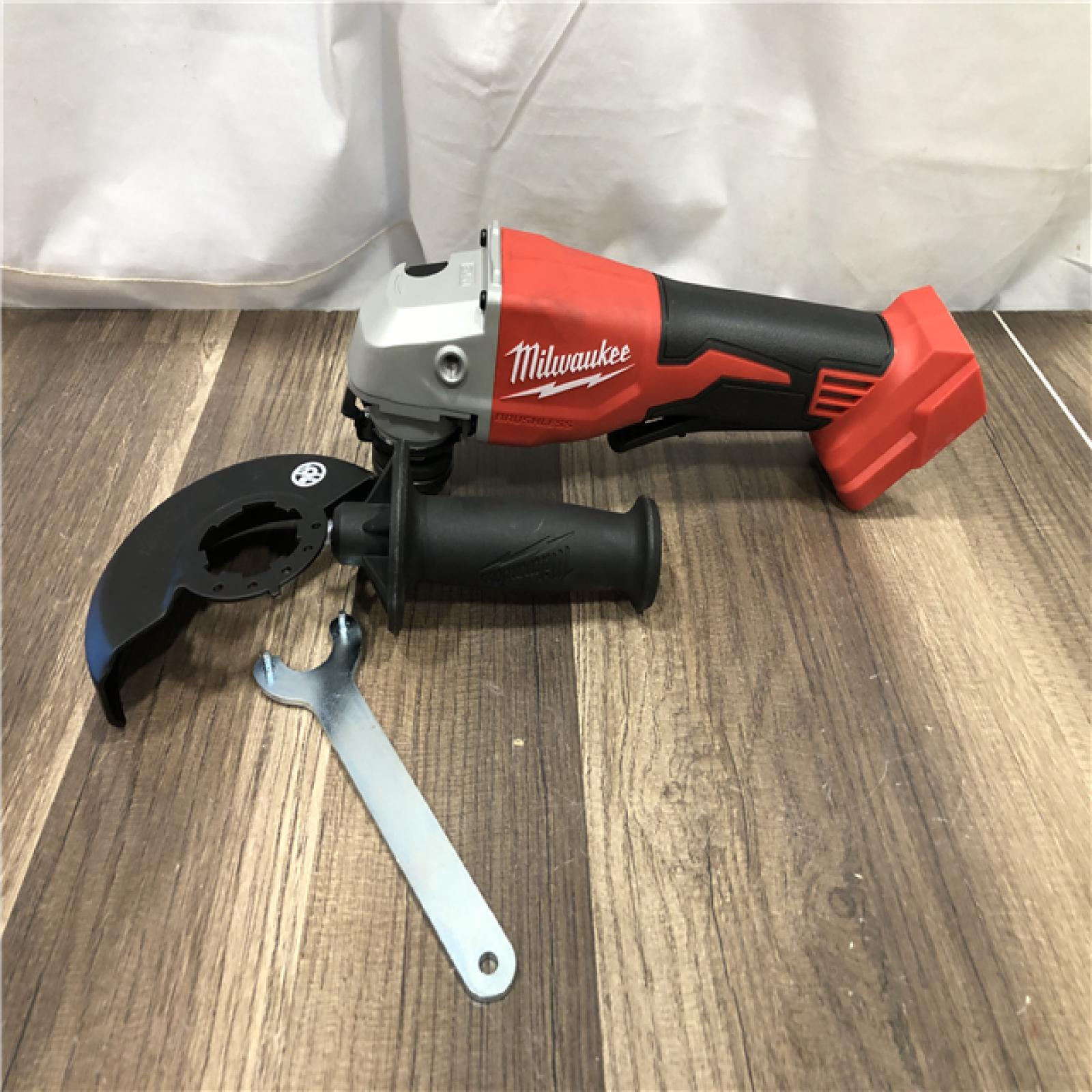 AS-IS Milwaukee 18V Lithium-Ion Brushless Cordless 4-1/2 in./5 in. Grinder w/Paddle Switch (Tool-Only)