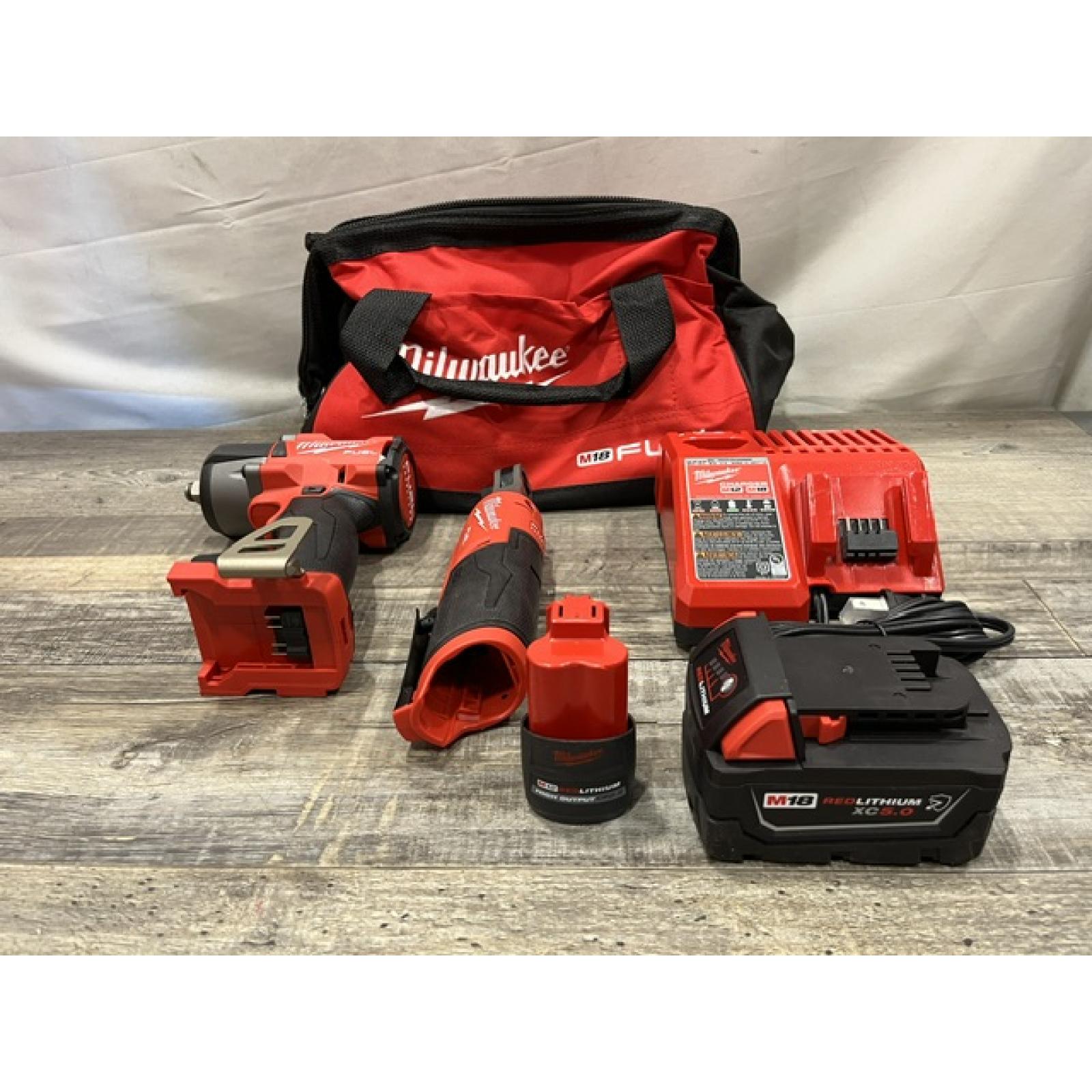 AS-IS Milwaukee FUEL 18V Cordless Mid Torque 1/2 in. Impact Wrench w/ 12 FUEL 3/8 in. Ratchet Combo Kit