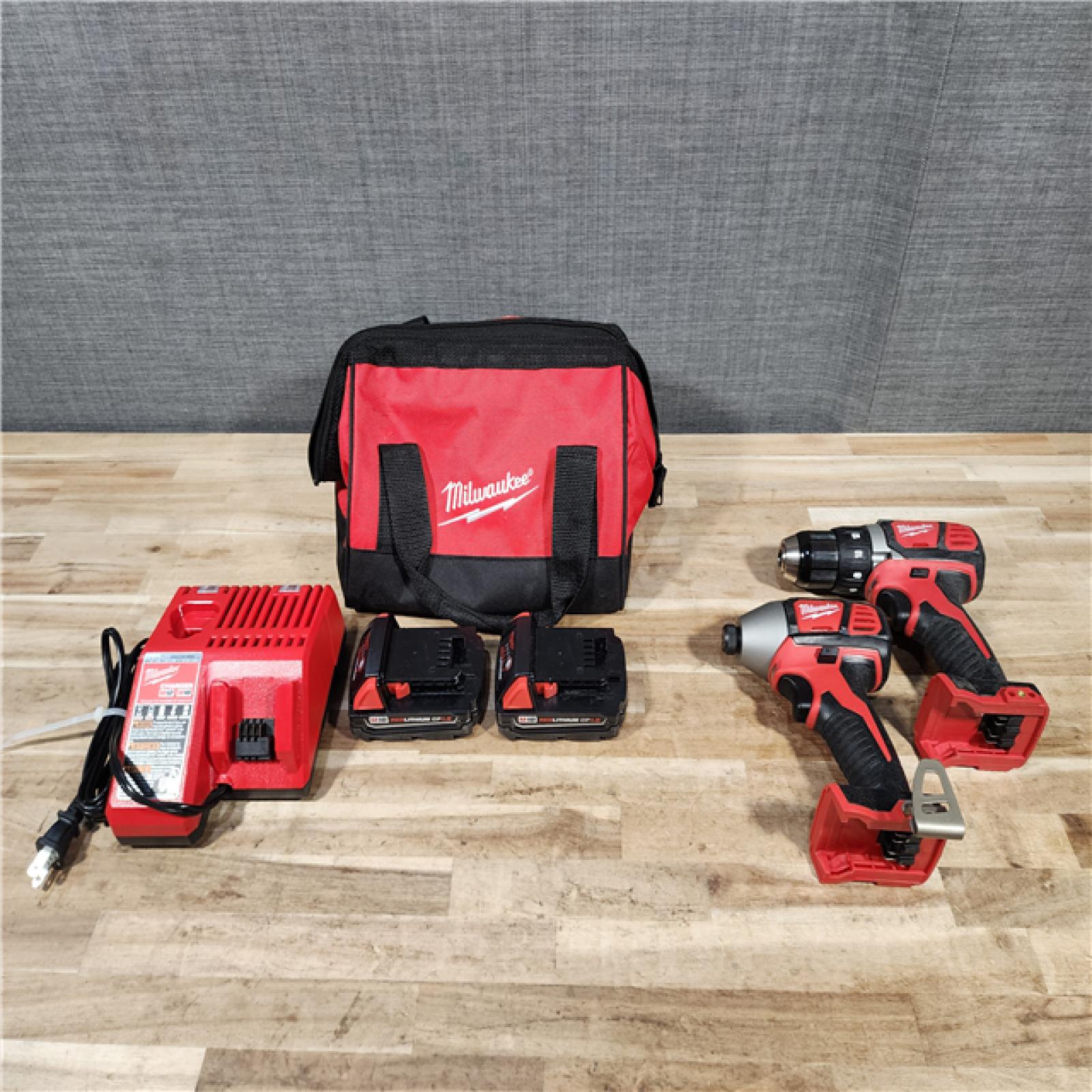 HOUSTON LOCATION - AS-IS Milwaukee 18V Lithium-Ion Cordless Drill Driver/Impact Driver Combo Kit