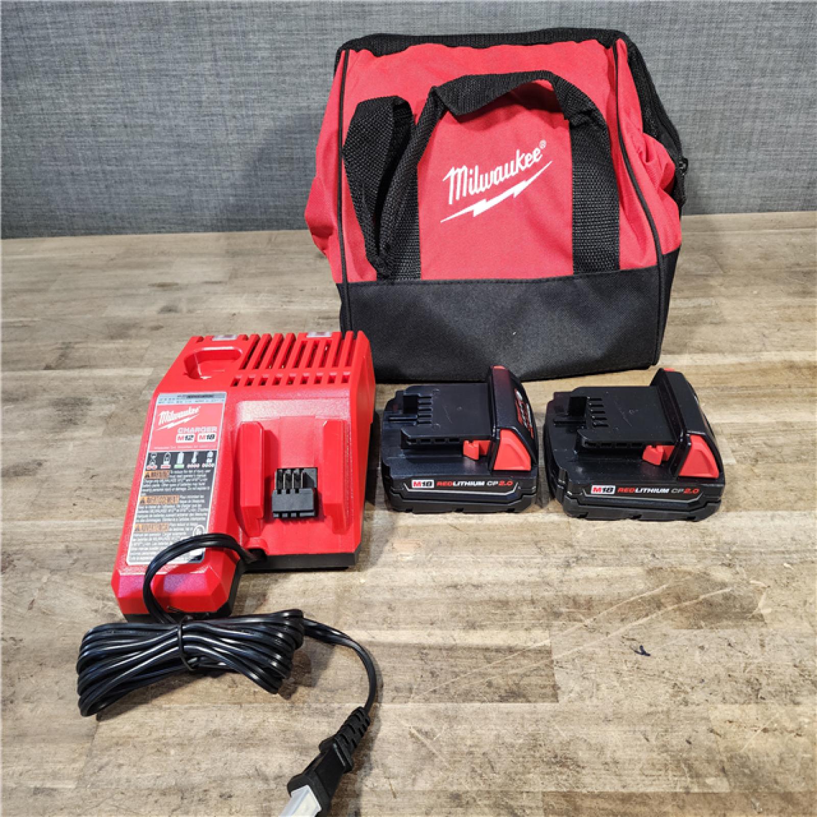 HOUSTON LOCATION - AS-IS Milwaukee M18 18V Lithium-Ion Brushless Cordless Compact Drill/Impact Combo Kit (2-Tool) W/(2) 2.0 Ah Batteries  Charger & Bag