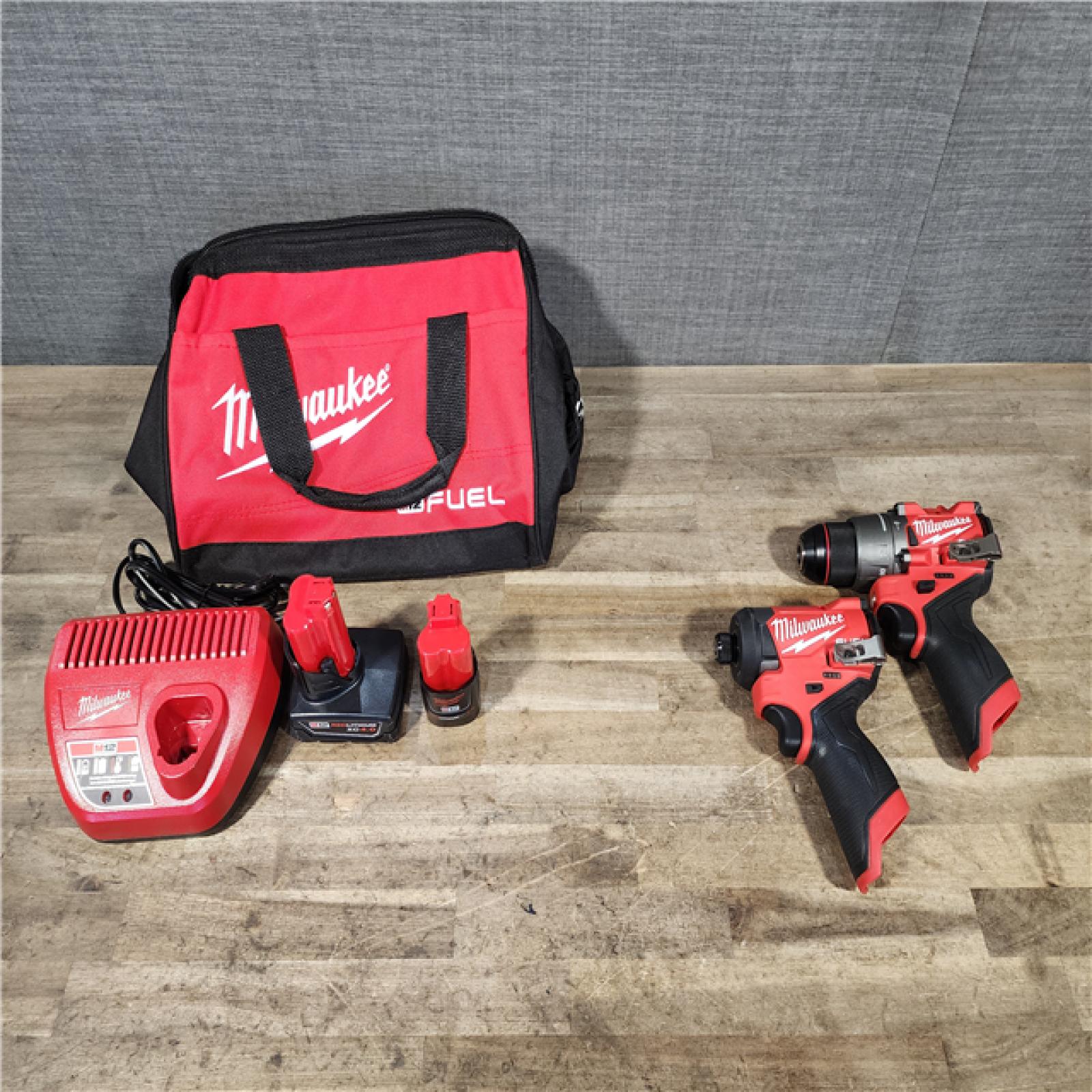 HOUSTON LOCATION - AS-IS Milwaukee FUEL 12-Volt Lithium-Ion Brushless Cordless Hammer Drill and Impact Driver Combo Kit