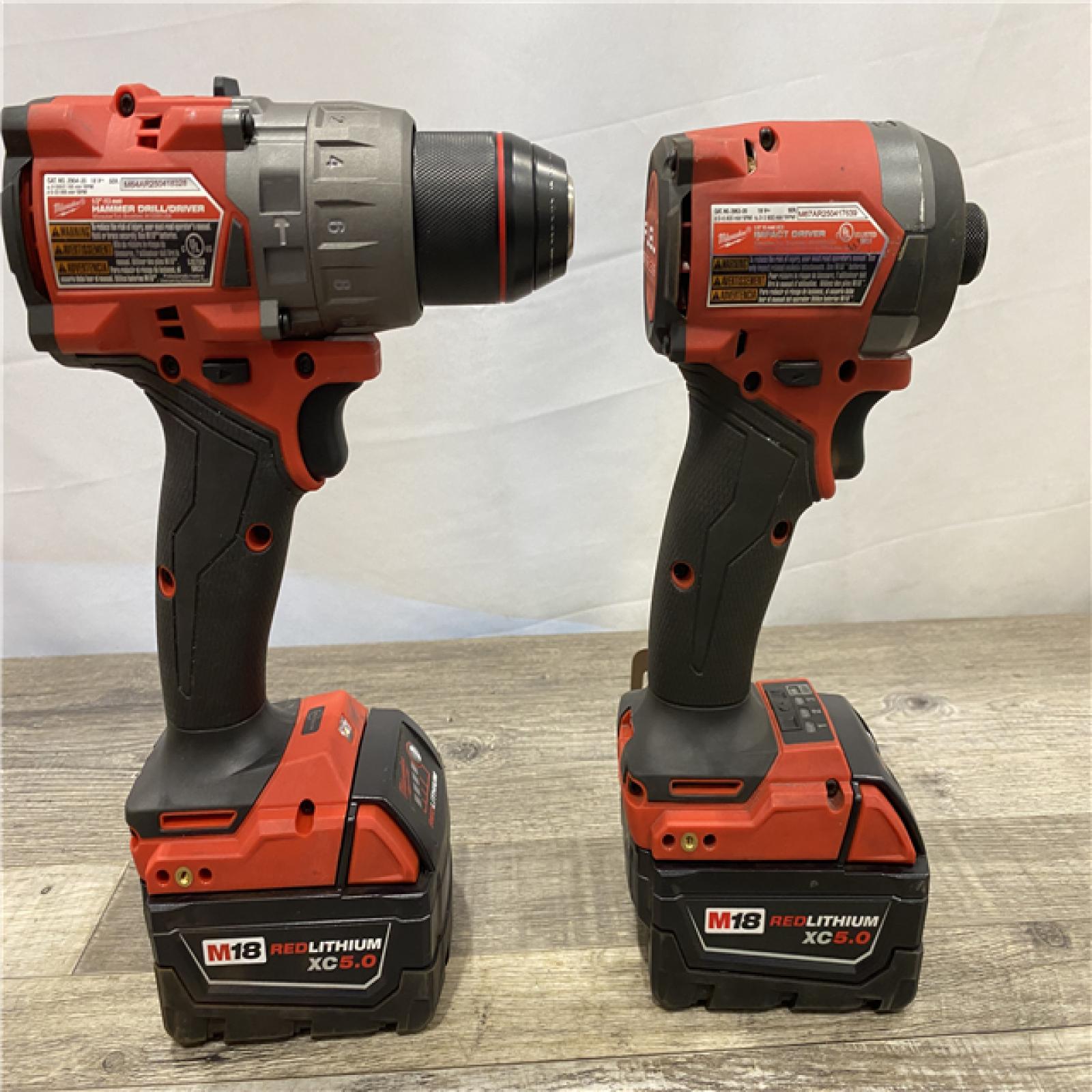 AS-IS Milwaukee FUEL 18V Lithium-Ion Brushless Cordless Hammer Drill and Impact Driver Combo Kit (2-Tool) with 2 Batteries
