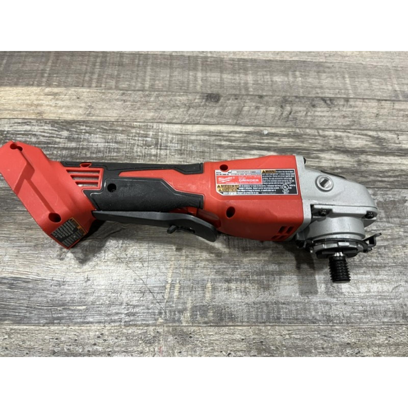 AS-IS Milwaukee 18V Lithium-Ion Brushless Cordless 4-1/2 in./5 in. Grinder w/Paddle Switch (Tool-Only)
