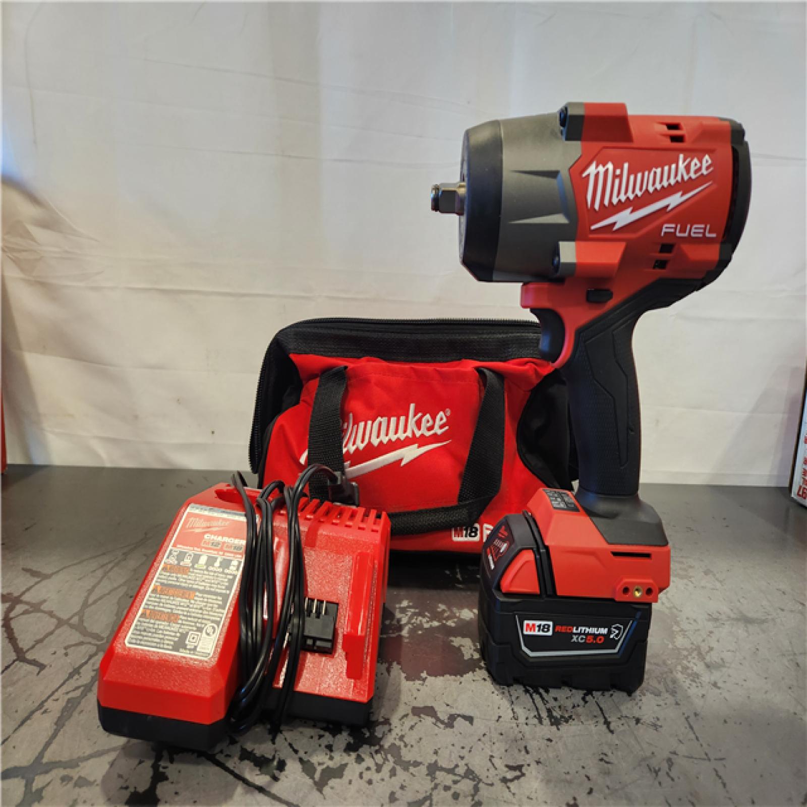 AS-IS  Milwaukee M18 1/2 in. Cordless Brushless High Torque Impact Wrench Kit (Battery & Charger)