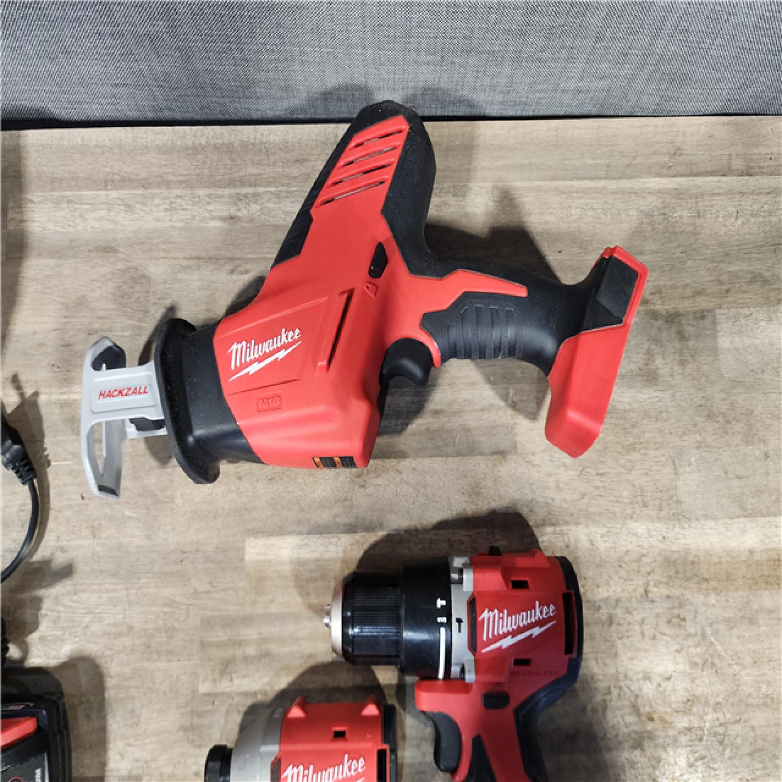 HOUSTON LOCATION - AS-IS MILWAUKEE 3 TOOL COMBO KIT W/ (2) BATTERY & CHARGER
