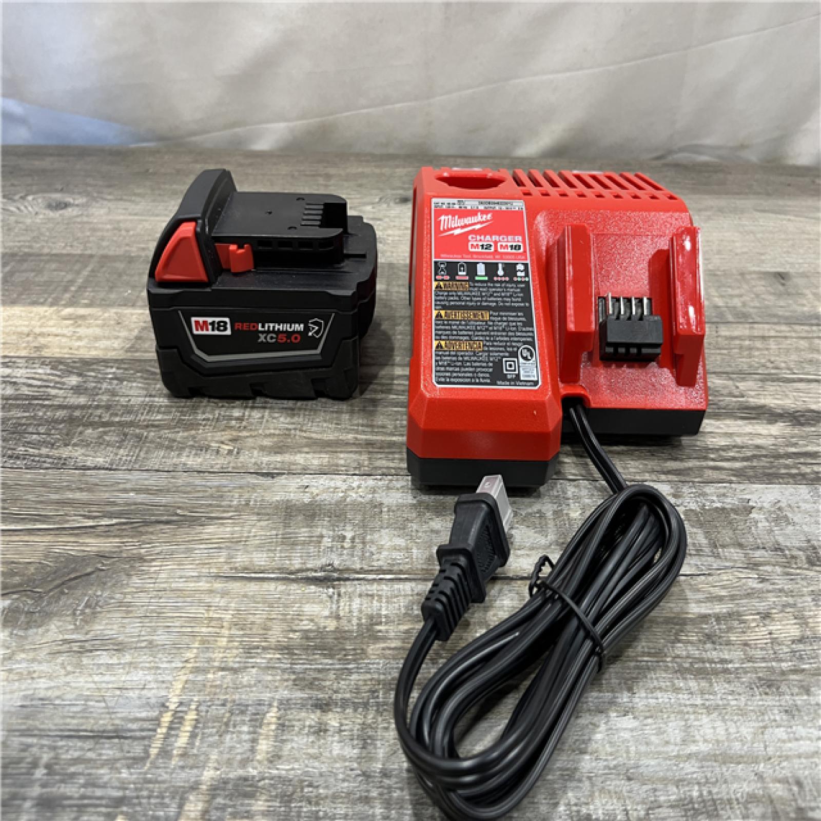 AS-IS Milwaukee 18-Volt Lithium-Ion XC Starter Kit with One 5.0Ah Battery and Charger