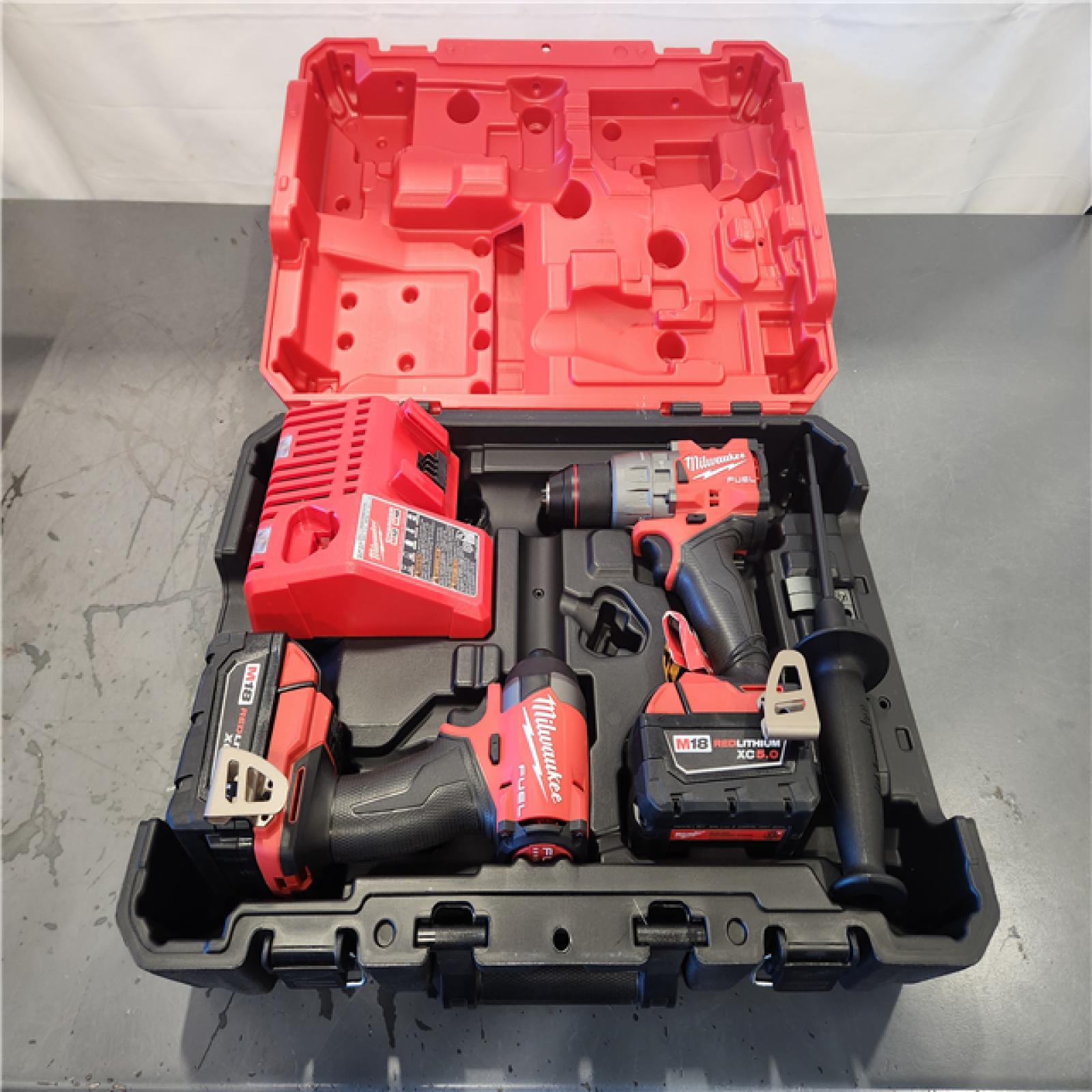 AS-IS - Milwaukee M18 FUEL 18V Lithium-Ion Brushless Cordless Hammer Drill and Impact Driver Combo Kit (2-Tool) with 2 Batteries