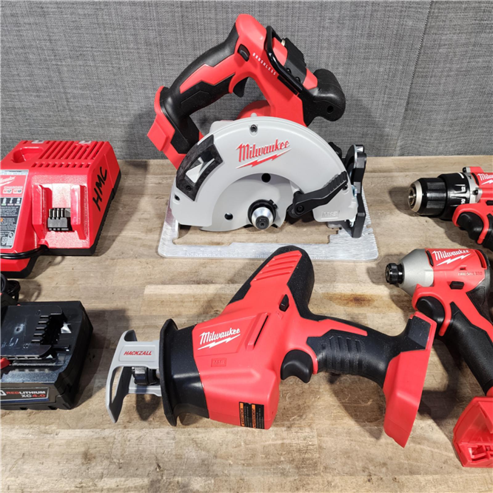 HOUSTON LOCATION - AS-IS Milwaukee M18 18-Volt Lithium-Ion Brushless Cordless Combo Kit (4-Tool) with 2-Batteries  1-Charger and Tool Bag