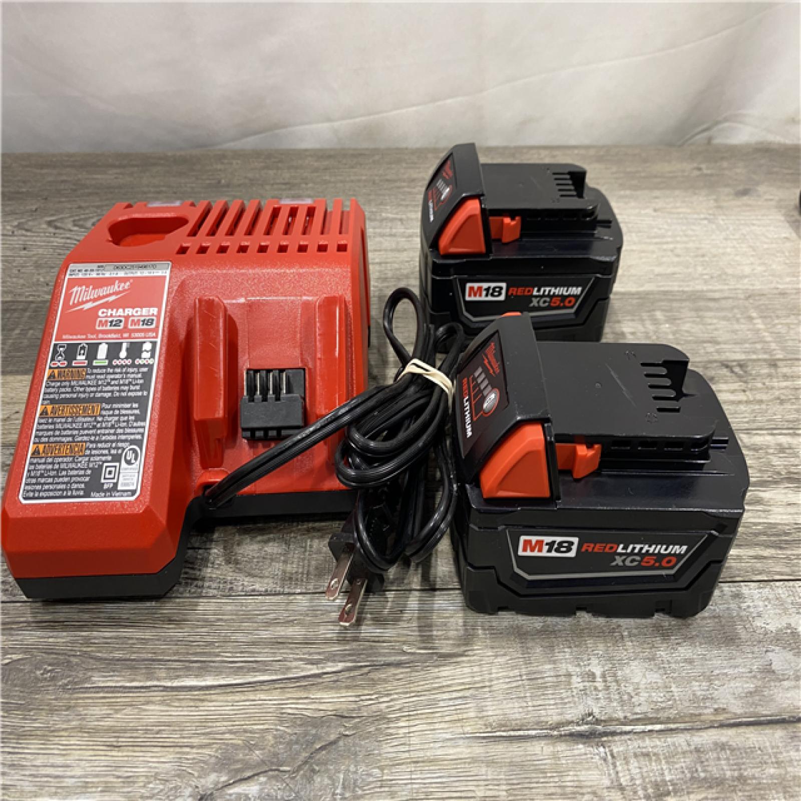 AS-IS Milwaukee 18-Volt Lithium-Ion XC Starter Kit with Two 5.0Ah Batteries and Charger