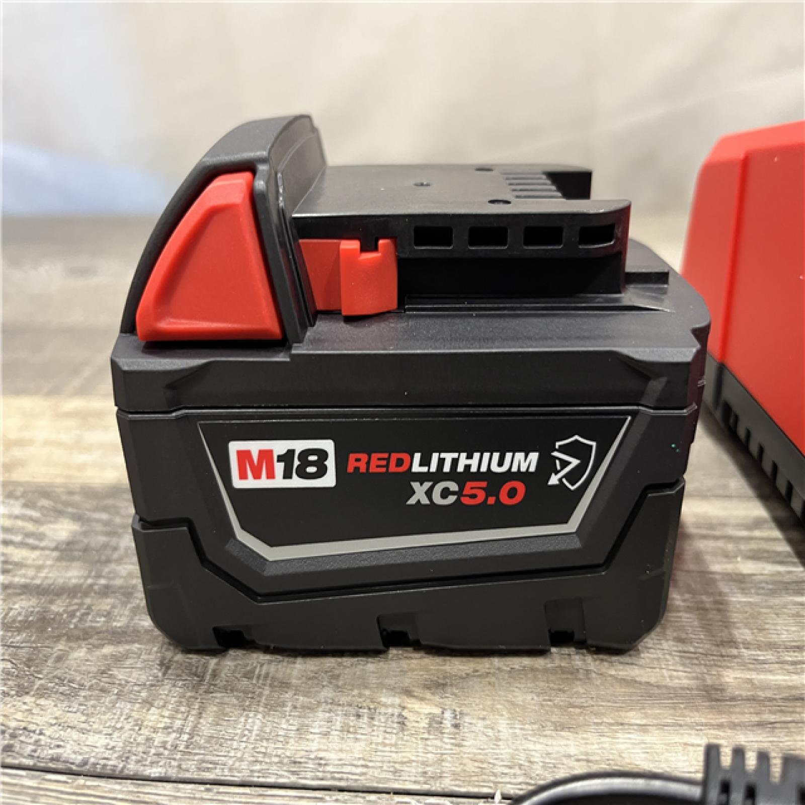 AS-IS Milwaukee 18-Volt Lithium-Ion XC Starter Kit with One 5.0Ah Battery and Charger