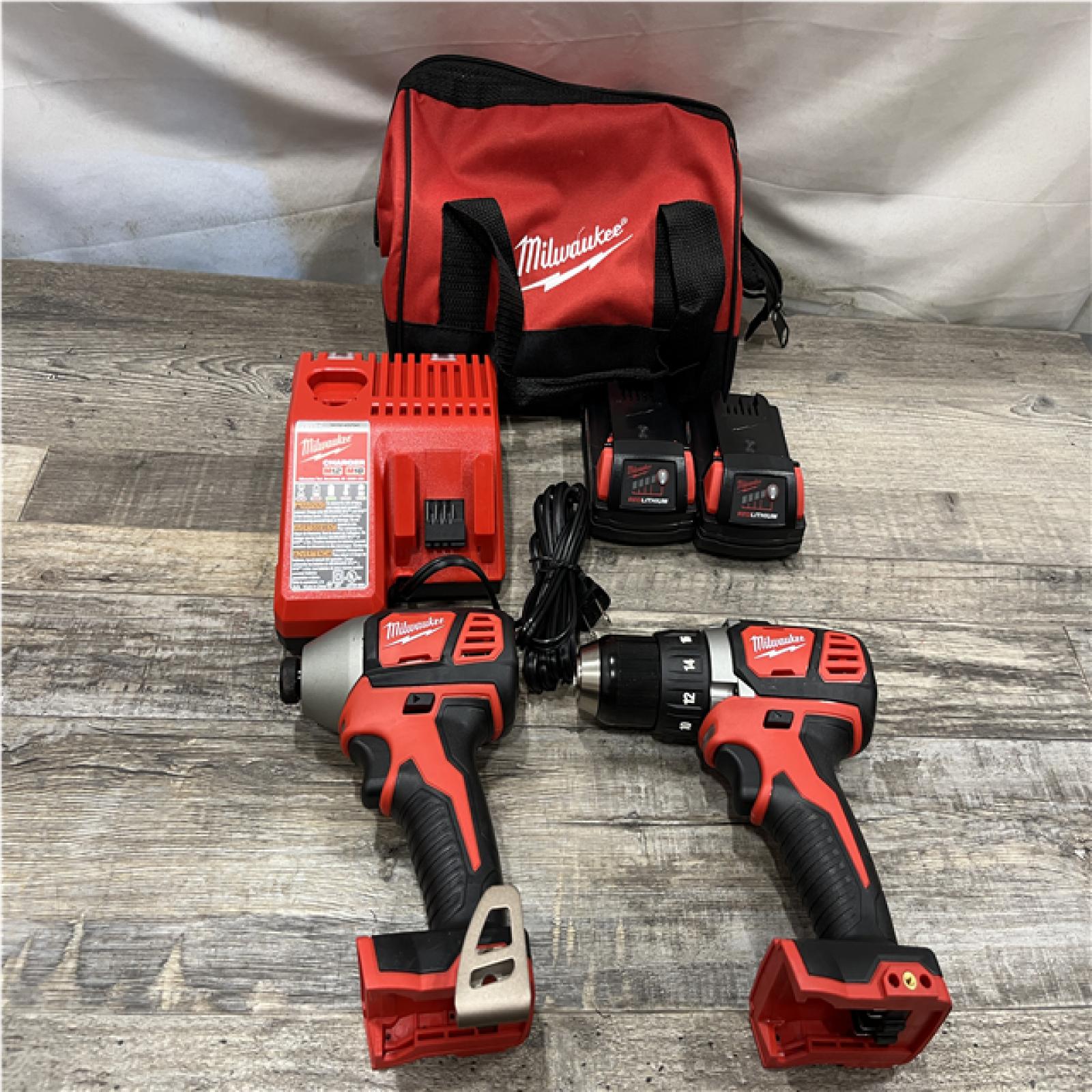 AS-IS Milwaukee 18V Lithium-Ion Cordless Drill Driver/Impact Driver Combo Kit