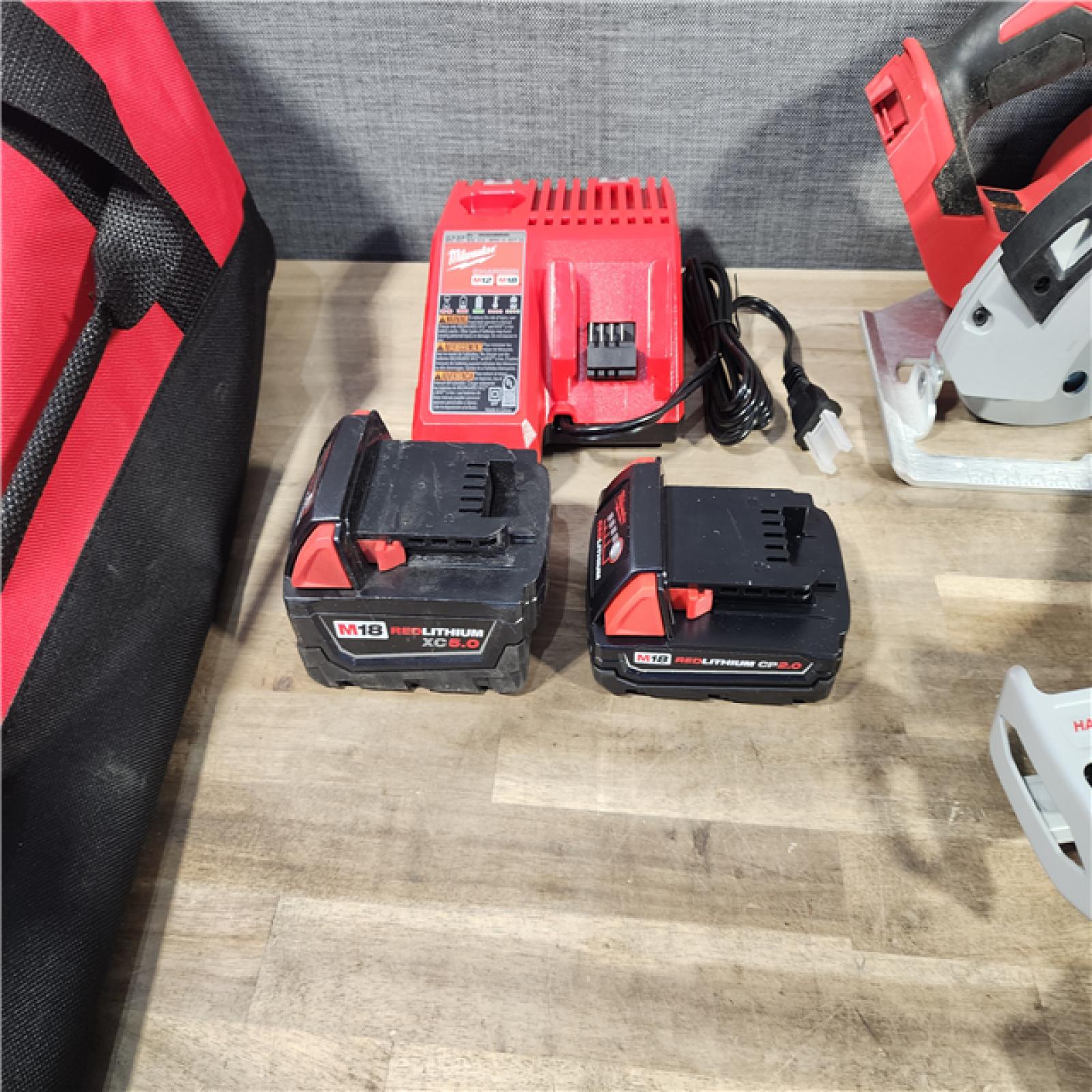 HOUSTON LOCATION - AS-IS Milwaukee M18 18-Volt Lithium-Ion Brushless Cordless Combo Kit (4-Tool) with 2-Batteries, 1-Charger and Tool Bag
