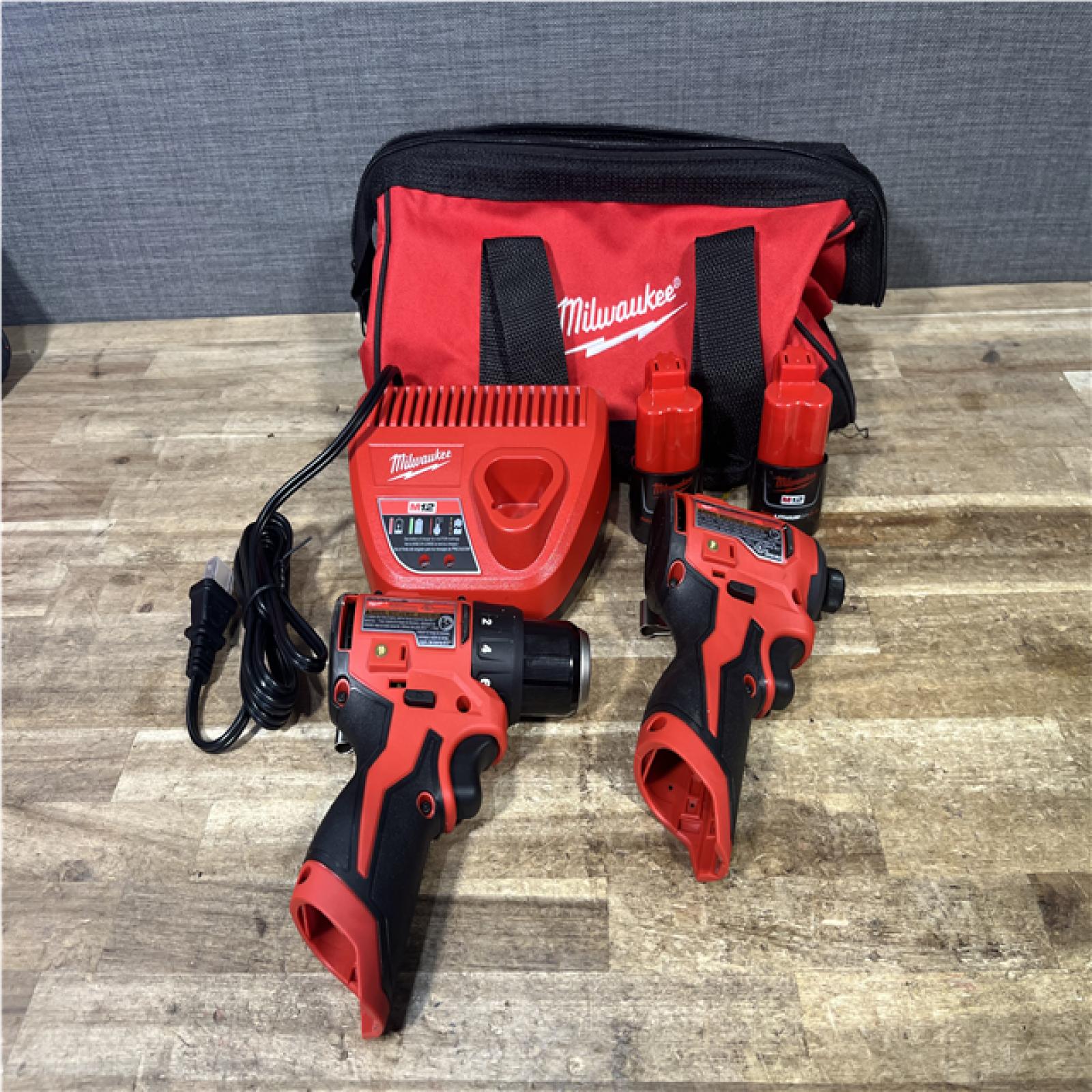Houston Location AS-Is Milwaukee Drill Driver and Impact Driver and 2 Batteries with Charger