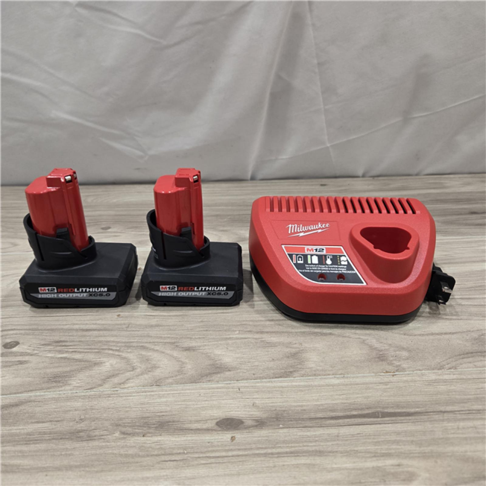 AS-IS Milwaukee M12 12V Lithium-Ion XC High Output 5.0 Ah Battery Pack (2-Pack) Starter Kit