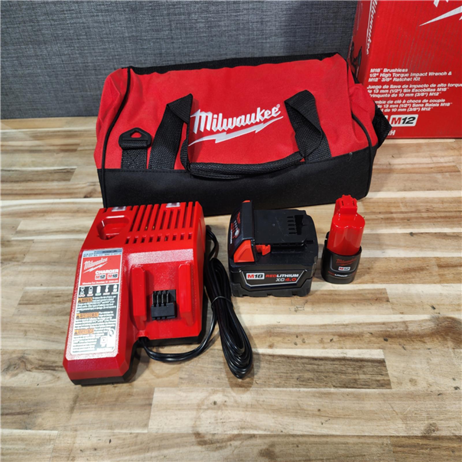 HOUSTON LOCATION - AS-IS Milwaukee 12/18V Lithium-Ion Cordless 3/8 in. Ratchet and 1/2 in. High Torque Impact Wrench with Friction Ring Combo Kit