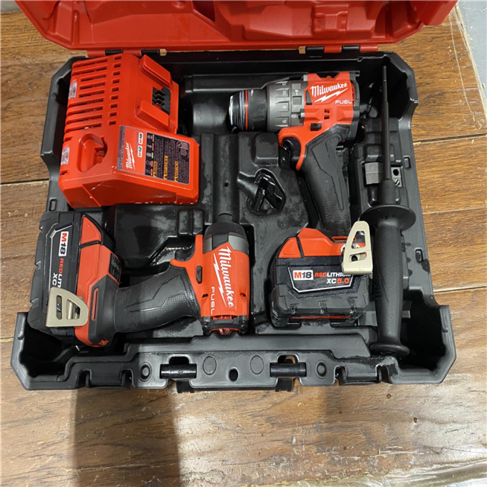 AS- IS MILWAUKEE M18 FUEL 18V Lithium-Ion Brushless Cordless Hammer Drill and Impact Driver Combo Kit (2-Tool) with 2 Batteries