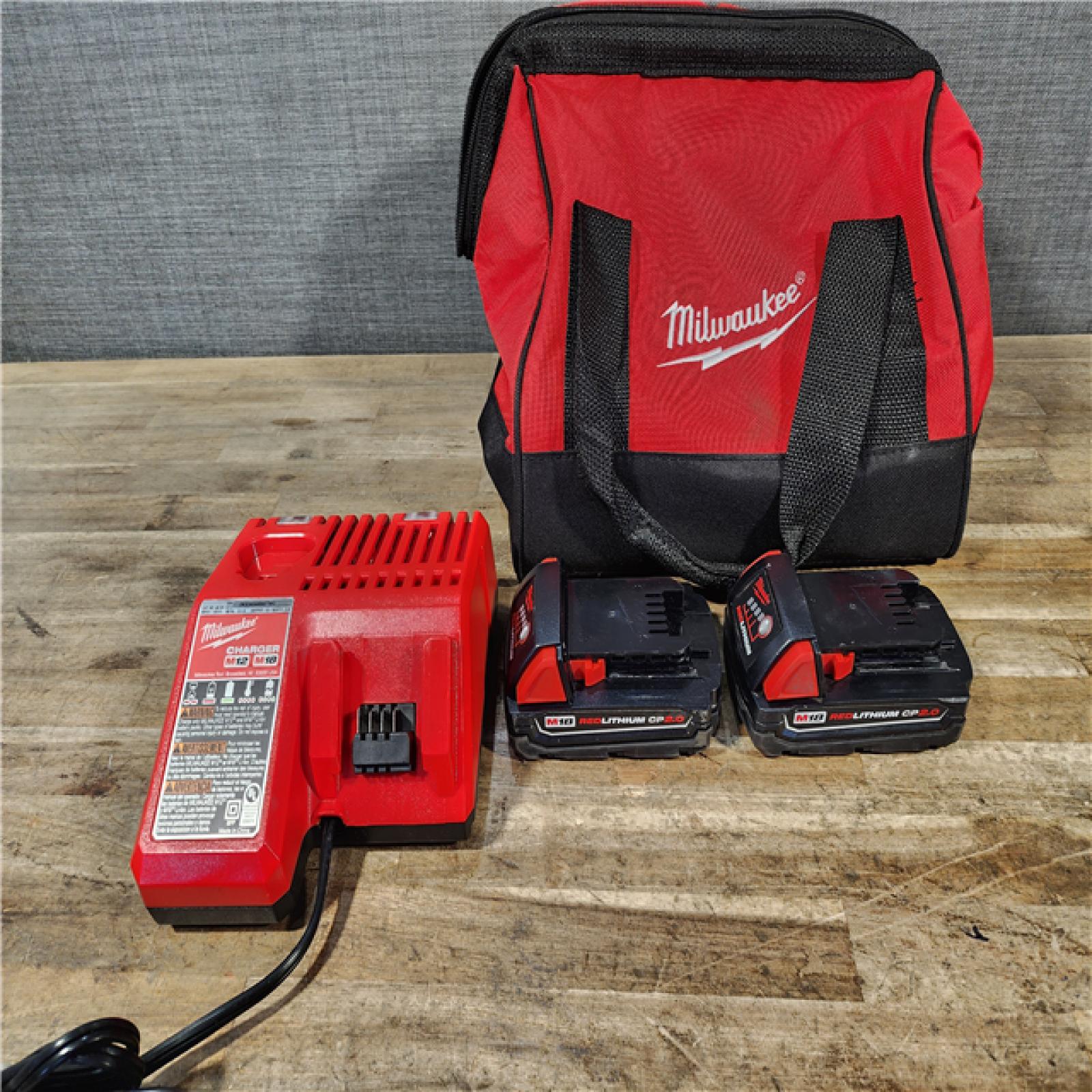 HOUSTON LOCATION - AS-IS Milwaukee M18 18V Lithium-Ion Brushless Cordless Compact Drill/Impact Combo Kit (2-Tool) W/(2) 2.0 Ah Batteries  Charger & Bag