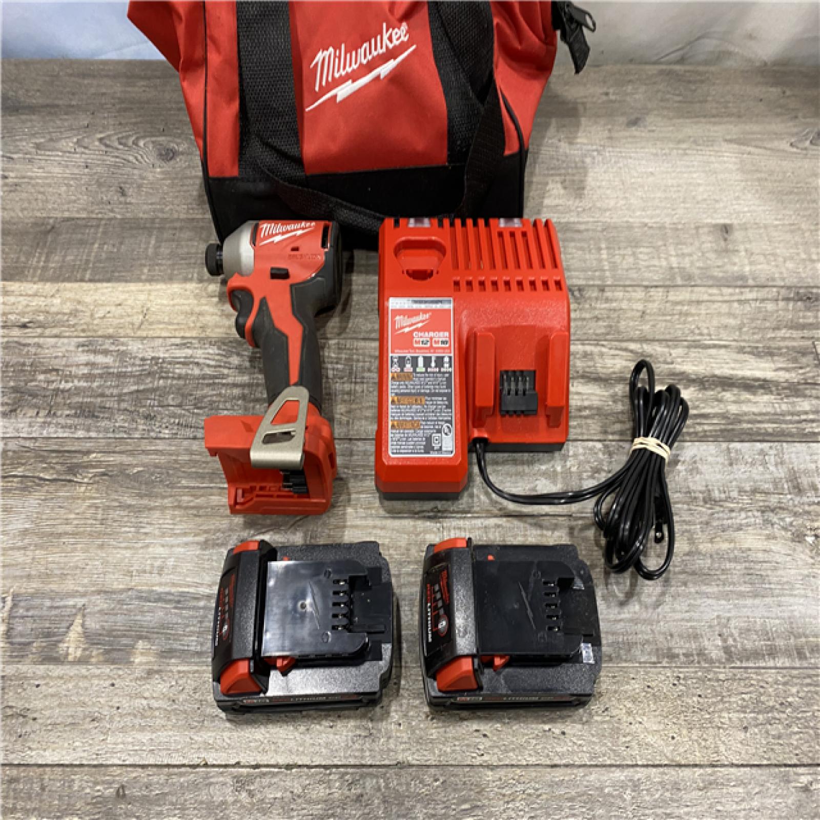 AS-IS Milwaukee 18V Lithium-Ion Brushless Cordless 1/4 in. Impact Driver Kit