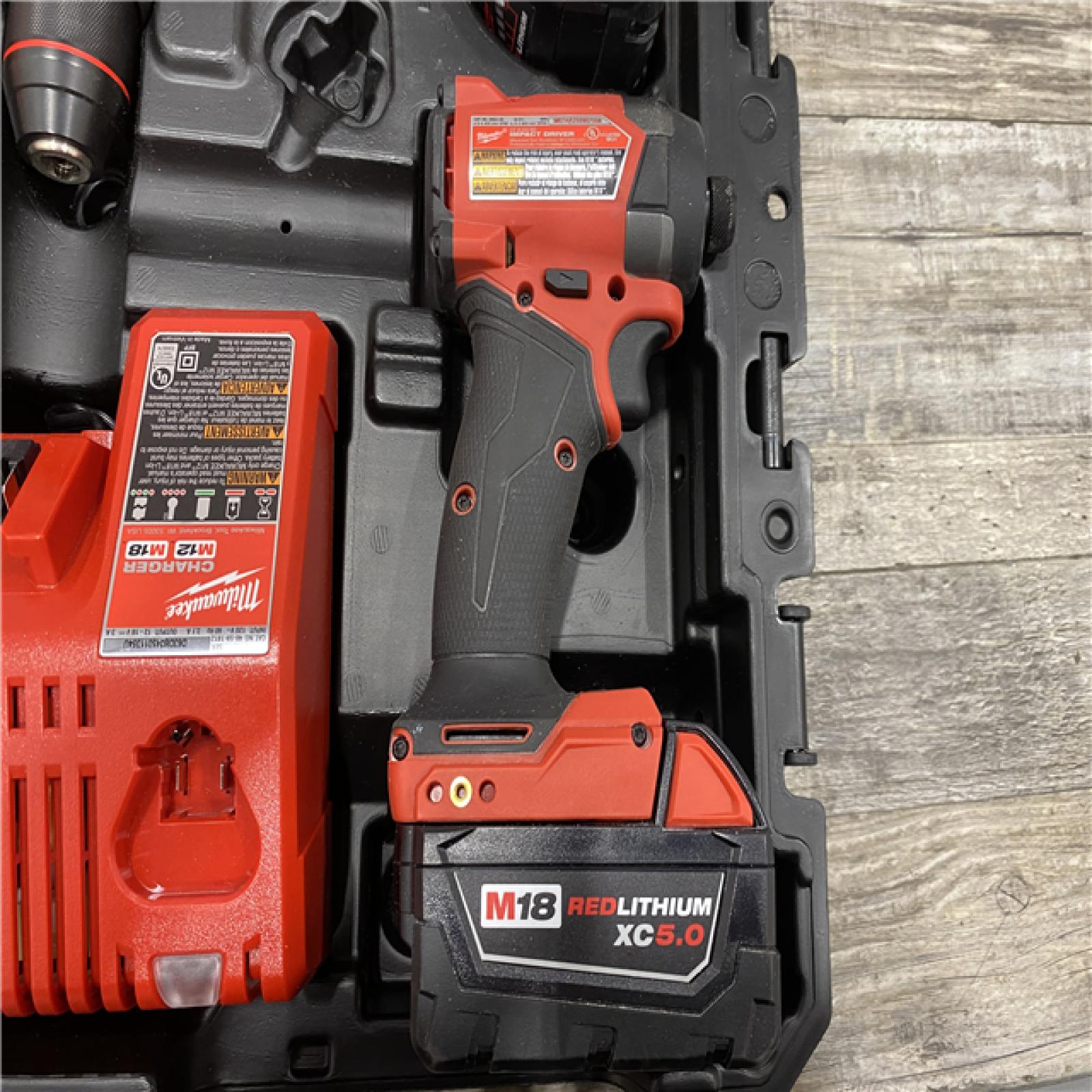 AS-IS Milwaukee FUEL 18V Lithium-Ion Brushless Cordless Hammer Drill and Impact Driver Combo Kit