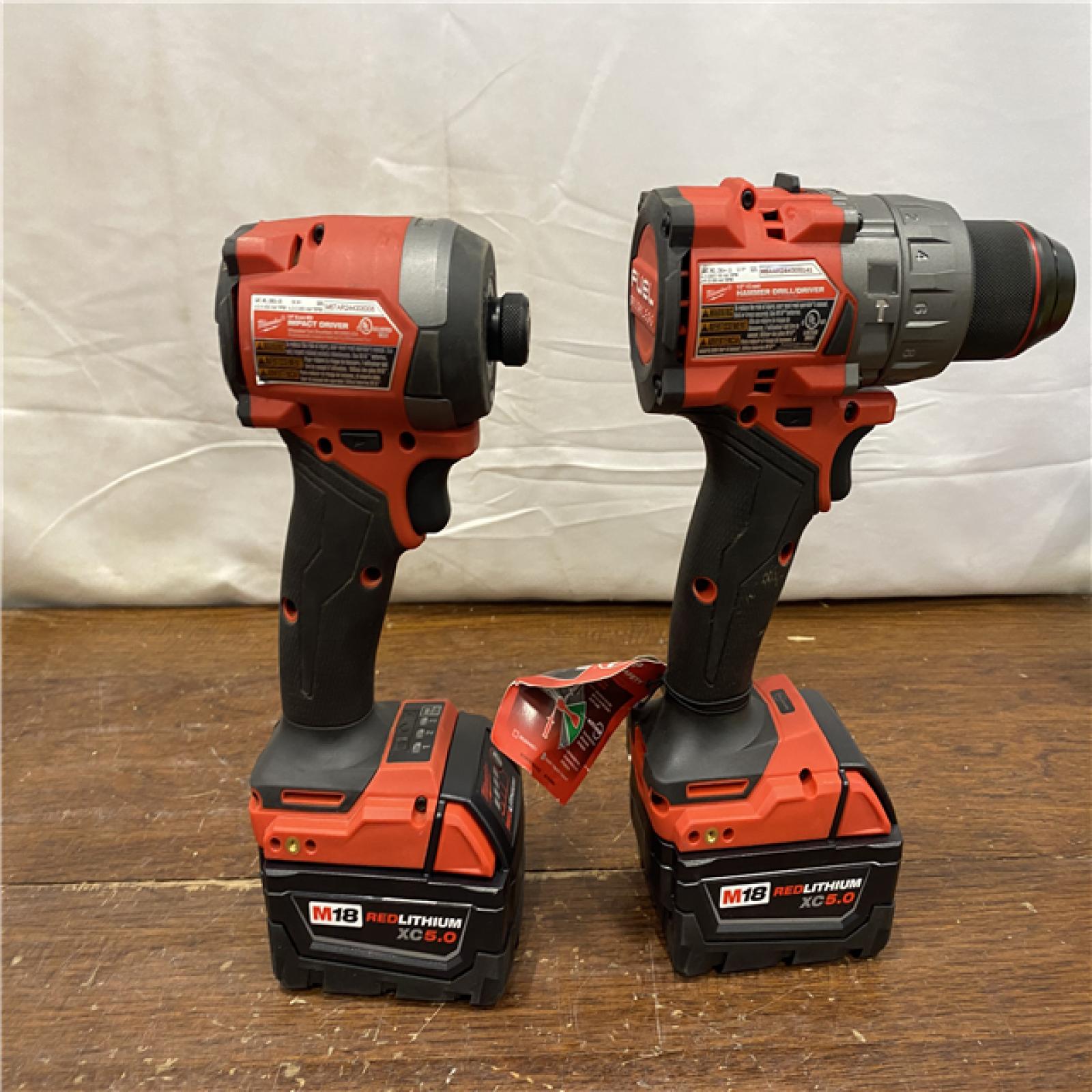 AS-IS MILWAUKEE M18 FUEL 18V Lithium-Ion Brushless Cordless Hammer Drill and Impact Driver Combo Kit (2-Tool) with 2 Batteries