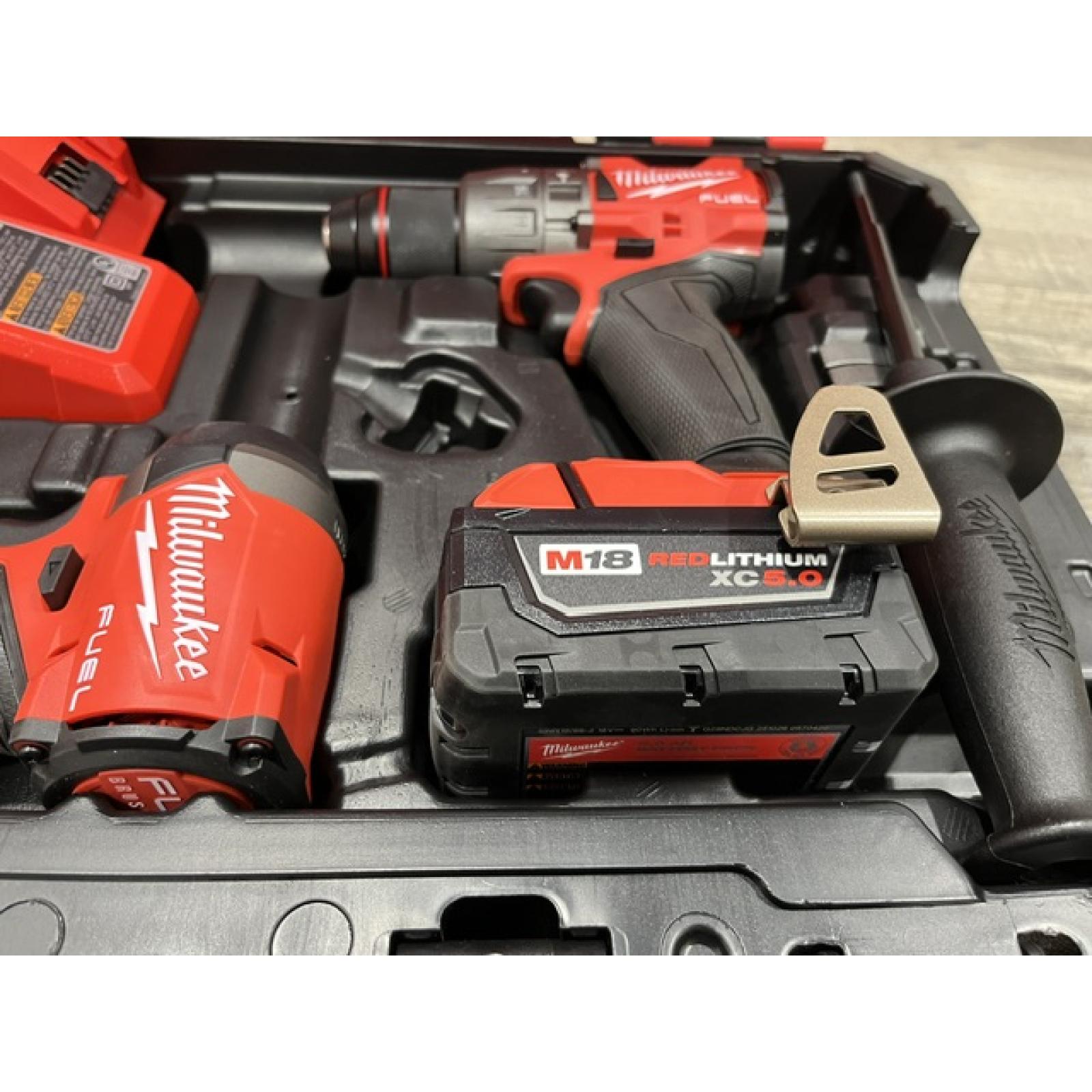 AS-IS Milwaukee FUEL 18V Lithium-Ion Brushless Cordless Hammer Drill and Impact Driver Combo Kit