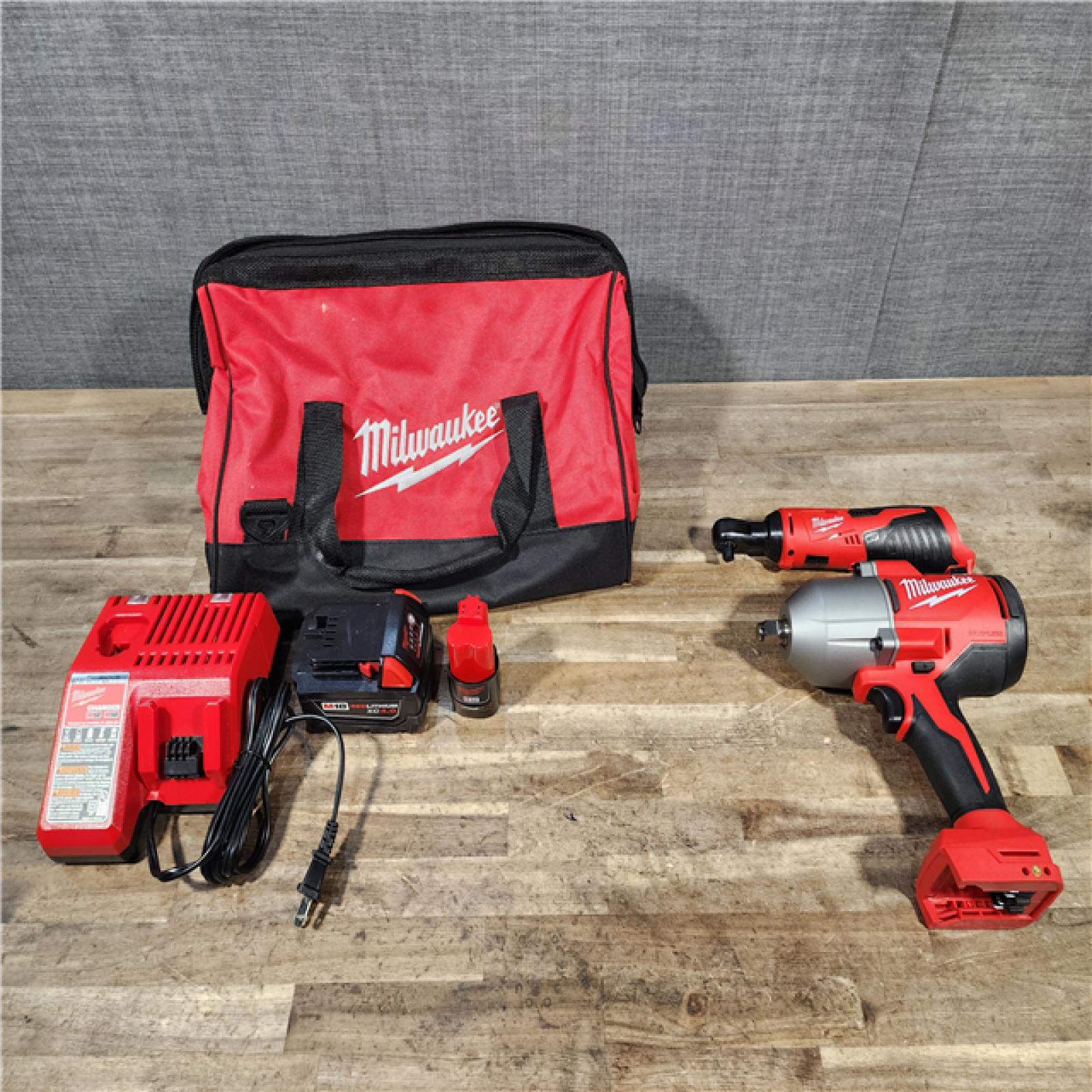 HOUSTON LOCATION - AS-IS Milwaukee 12/18V Lithium-Ion Cordless 3/8 in. Ratchet and 1/2 in. High Torque Impact Wrench with Friction Ring Combo Kit
