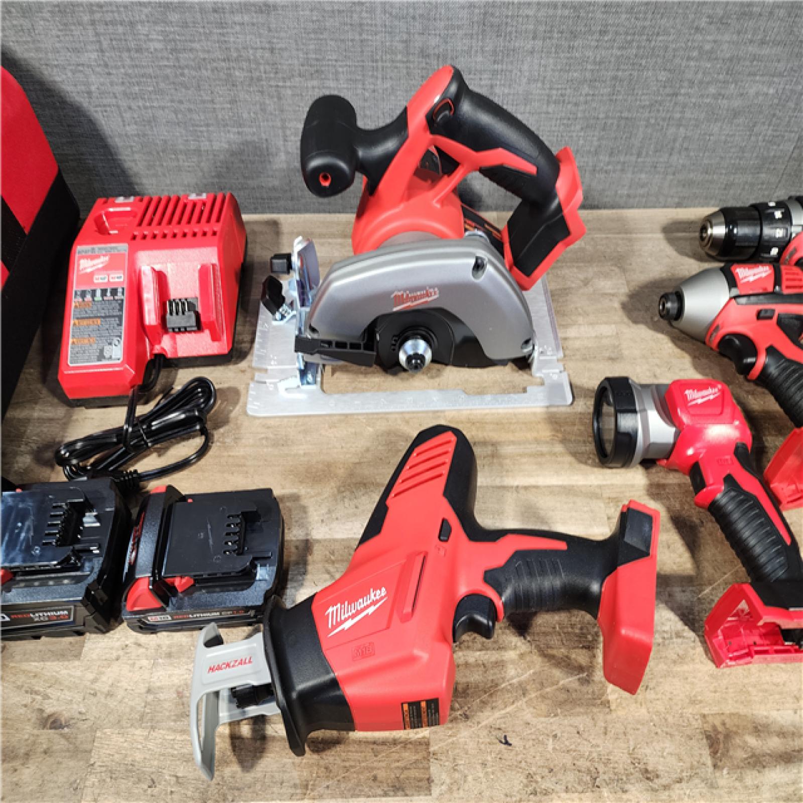 HOUSTON LOCATION - AS-IS (APPEARS LIKE NEW) Milwaukee M18 18-Volt Lithium-Ion Cordless Combo Tool Kit (5-Tool) with (1) 3.0Ah and (1) 1.5Ah Battery  (1) Charger  (1) Tool Bag