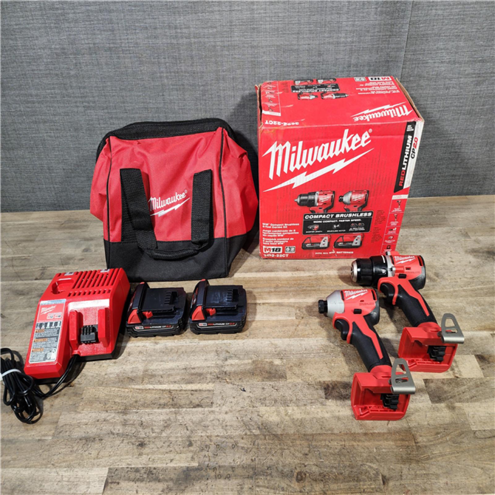 HOUSTON LOCATION - AS-IS Milwaukee M18 18V Lithium-Ion Brushless Cordless Compact Drill/Impact Combo Kit (2-Tool) W/(2) 2.0 Ah Batteries  Charger & Bag