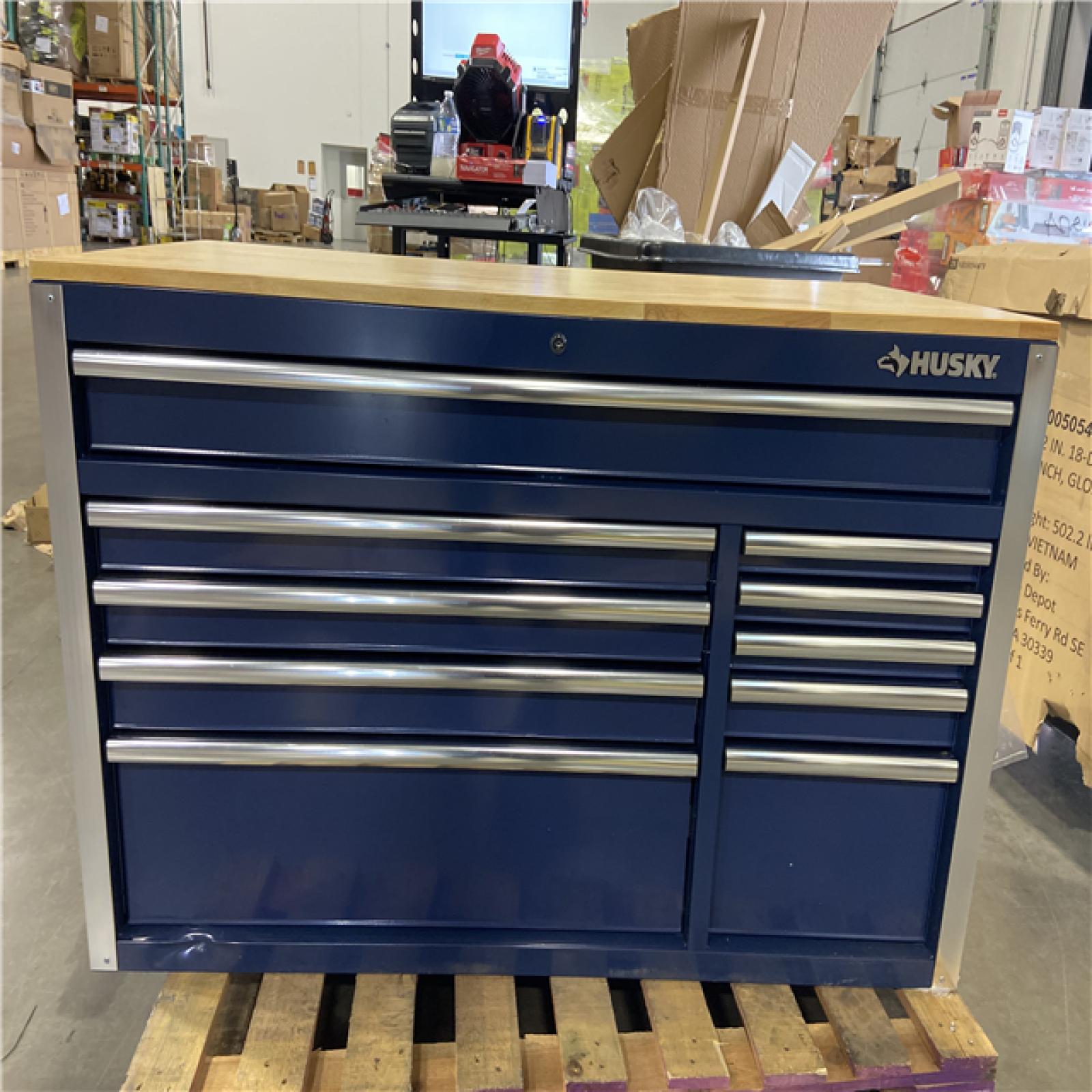 DALLAS LOCATION - Husky 52 in. W x 25 in. D 10-Drawer Mobile Workbench Tool Chest with Solid Wood Work Top in Gloss Blue