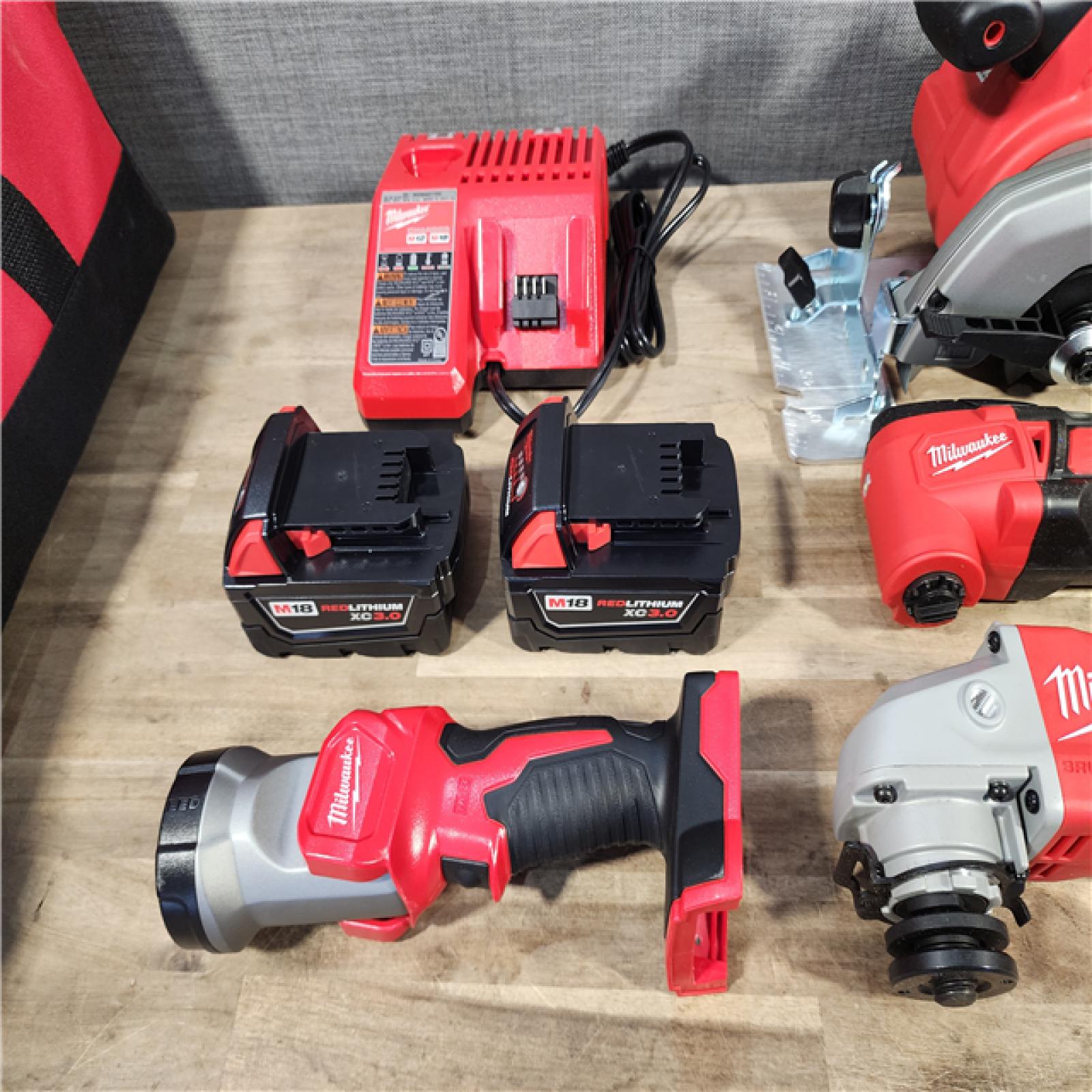 HOUSTON LOCATION - AS-IS (APPEARS LIKE NEW) Milwaukee M18 18-Volt Lithium-Ion Cordless Combo Kit 7-Tool with 2-Batteries, Charger and Tool Bag