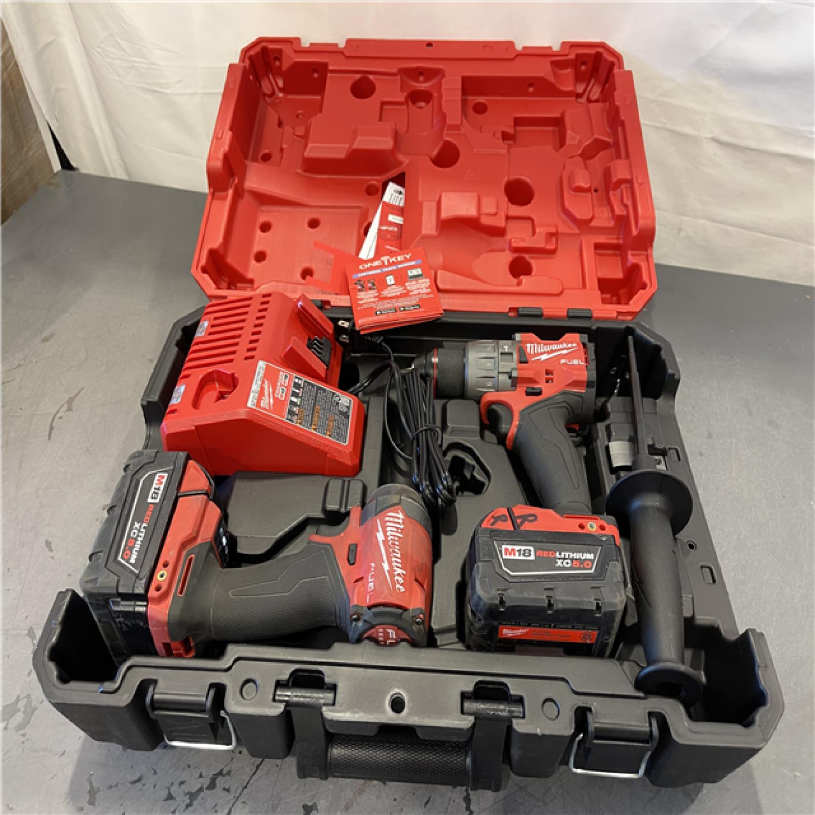 AS-IS - Milwaukee M18 FUEL 18V Lithium-Ion Brushless Cordless Hammer Drill and Impact Driver Combo Kit