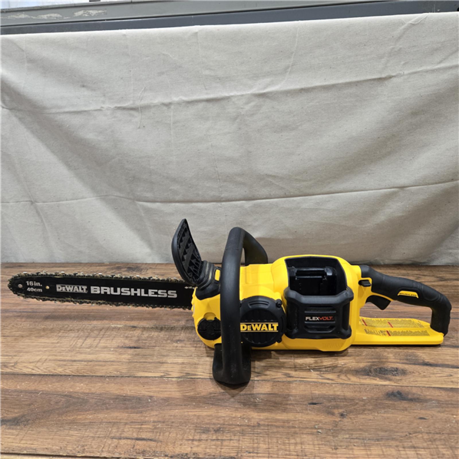 AS-IS DEWALT  FLEXVOLT 60V MAX 16in. Brushless Cordless Battery Powered Chainsaw Kit with (1) FLEXVOLT 2 Ah Battery & Charger